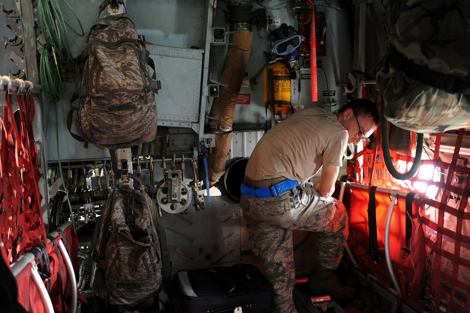 Senior Airman Gregory Beck, 374th Maintenance Squadron, Yokota Air Base, Japan, performs transient repair on a C-130 Hercules cargo plane after it was evacuated from Yokota to Kadena Air Base, Japan, due to incoming Typhoon Roke. According to news reports, more than six people were killed in mainland Japan by Typhoon Roke, which temporarily knocked out power at Yokota. (U.S. Air Force photo by Airman 1st Brooke P. Beers)