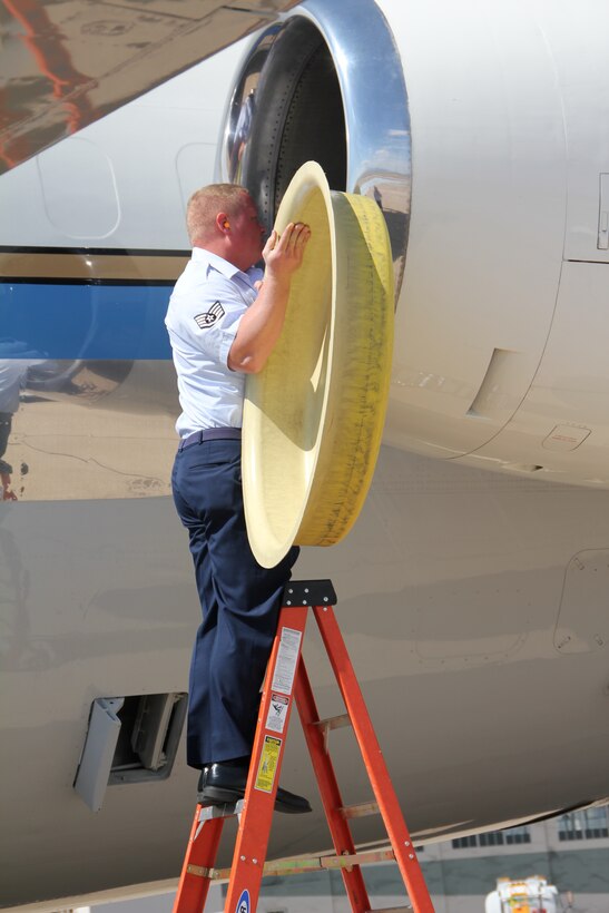 Staff Sgt. Joseph Wienhold, a flying crew chief, puts the final touches on the C-9C following her final flight as an Air Force Reserve aircraft.  (U.S. Air Force photo/Tech. Sgt. Dan Oliver)