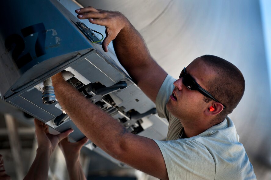 U.S. Air Force Senior Airman Kai Graves, 7th Aircraft Maintenance Squadron communication navigation journeyman, Dyess Air Force Base, Texas, prepares to mount a sniper targeting pod on a B-1B Lancer before a training mission during Green Flag-West 11-10 Sept. 20, 2011, at Nellis AFB, Nev. Green Flag-West provides a realistic close-air support training environment for forces preparing to support worldwide combat operations.(U.S. Air Force photo by Airman 1st Class George Goslin/Released)