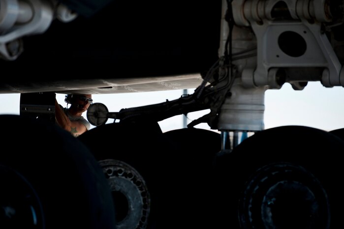U.S. Air Force Airman 1st Class Bradley Skelton, 7th Aircraft Maintenance Squadron crew chief, Dyess Air Force Base, Texas, performs pre-flight checks on a B-1B Lancer before a training mission during Green Flag-West 11-10 Sept. 20, 2011, at Nellis AFB, Nev. Green Flag-West provides a realistic close-air support training environment for forces preparing to support worldwide combat operations.(U.S. Air Force photo by Airman 1st Class George Goslin/Released)