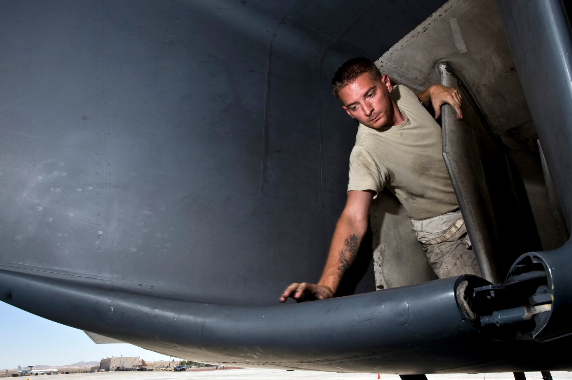U.S. Air Force Staff Sgt. Billy Doncer, 7th Aircraft Maintenance Squadron crew chief, Dyess Air Force Base, Texas, completes an intake inspection on a B1-B Lancer during a post flight check at Green Flag-West 11-10 Sept. 20, 2011, at Nellis AFB, Nev. Green Flag-West provides a realistic close-air support training environment for forces preparing to support worldwide combat operations.(U.S. Air Force photo by Senior Airman Brett Clashman/Released)
