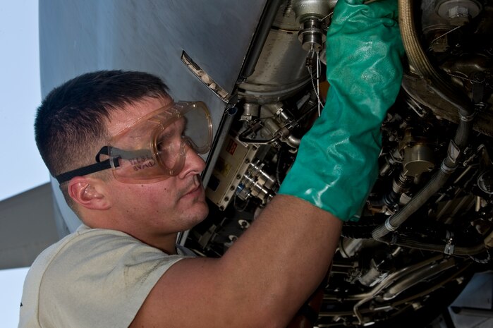 U.S. Air Force Senior Airman Brenton Evans, 7th Aircraft Maintenance Squadron hydraulics mechanic, Dyess Air Force Base, Texas, refills the hydraulic fluid on a B-1B Lancer during Green Flag-West 11-10 Sept. 20, 2011, at Nellis AFB, Nev. Green Flag-West provides a realistic close-air support training environment for forces preparing to support worldwide combat operations. (U.S. Air Force photo by Airman 1st Class Matthew Lancaster/Released)