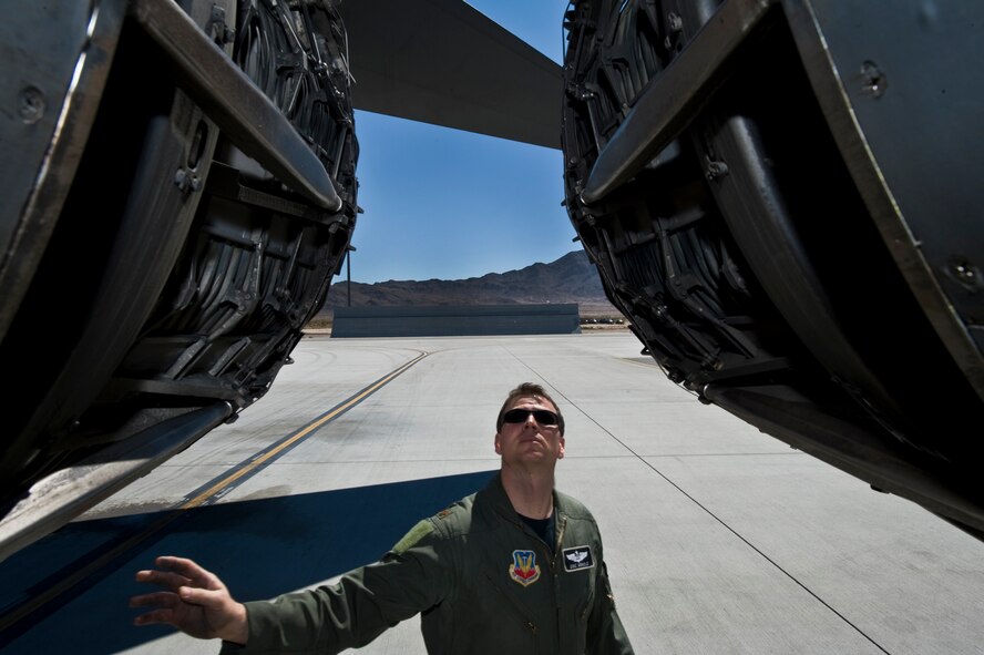 U.S. Air Force Maj. Eric Arnold, 9th Bomb Squadron weapons systems operator, Dyess Air Force Base, Texas, conducts a pre-flight inspection on a B-1B Lancer before a training mission during Green Flag-West 11-10  Sept. 20, 2011, at Nellis AFB. Nev. Green Flag-West provides a realistic close-air support training environment for forces preparing to support worldwide combat operations. (U.S. Air Force photo by Airman 1st Class Daniel Hughes/Released)