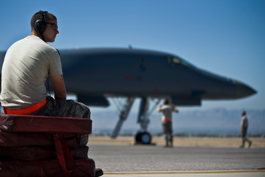 U.S. Air Force Staff Sgt. Jeff Greene, 7th Equipment Maintenance Squadron crew chief, Dyess Air Force Base, Texas, waits for aircrew members before a training mission during Green Flag-West 11-10 Sept. 20, 2011, at Nellis AFB. Nev. Green Flag-West provides a realistic close-air support training environment for forces preparing to support worldwide combat operations. (U.S. Air Force photo by Airman 1st Class Daniel Hughes/Released)