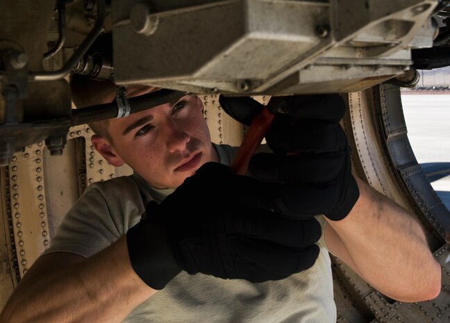 U.S. Air Force Staff Sgt. Justin Sparks, 7th Aircraft Maintenance Squadron engine mechanic,  Dyess Air Force Base, Texas, conducts maintenance on a B-1B Lancer during Green Flag-West 11-10 Sept. 20, 2011, at Nellis AFB, Nev. Green Flag-West provides a realistic close-air support training environment for forces preparing to support worldwide combat operations. (U.S. Air Force photo by Staff Sgt. Christopher Hubenthal/Released)