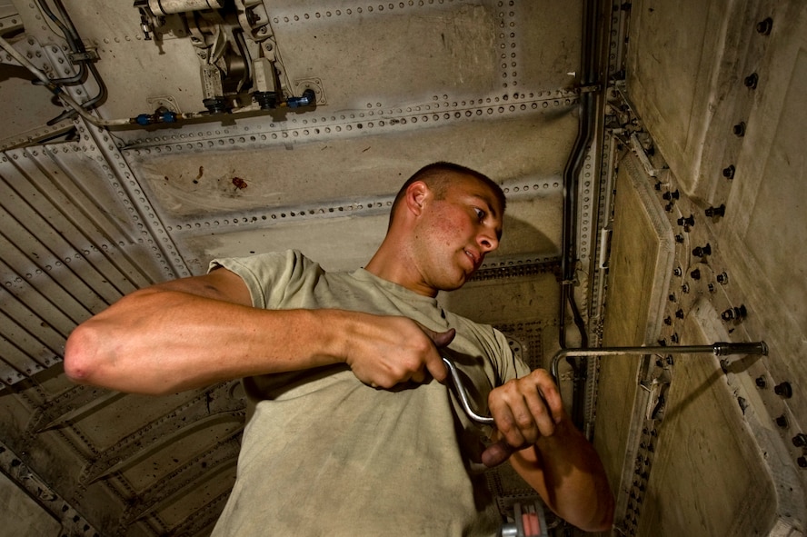 U.S. Air Force Airman 1st Class Joshua Jackson, 7th Aircraft Maintenance Squadron instrument and flight control systems apprentice, Dyess Air Force Base, Texas, performs maintenance in a B-1B Lancer  bomb bay during Green Flag-West 11-10 Sept. 15, 2011, at Nellis AFB. Nev. Green Flag-West provides a realistic close-air support training environment for forces preparing to support worldwide combat operations. (U.S. Air Force photo by Airman 1st Class Daniel Hughes/Released)