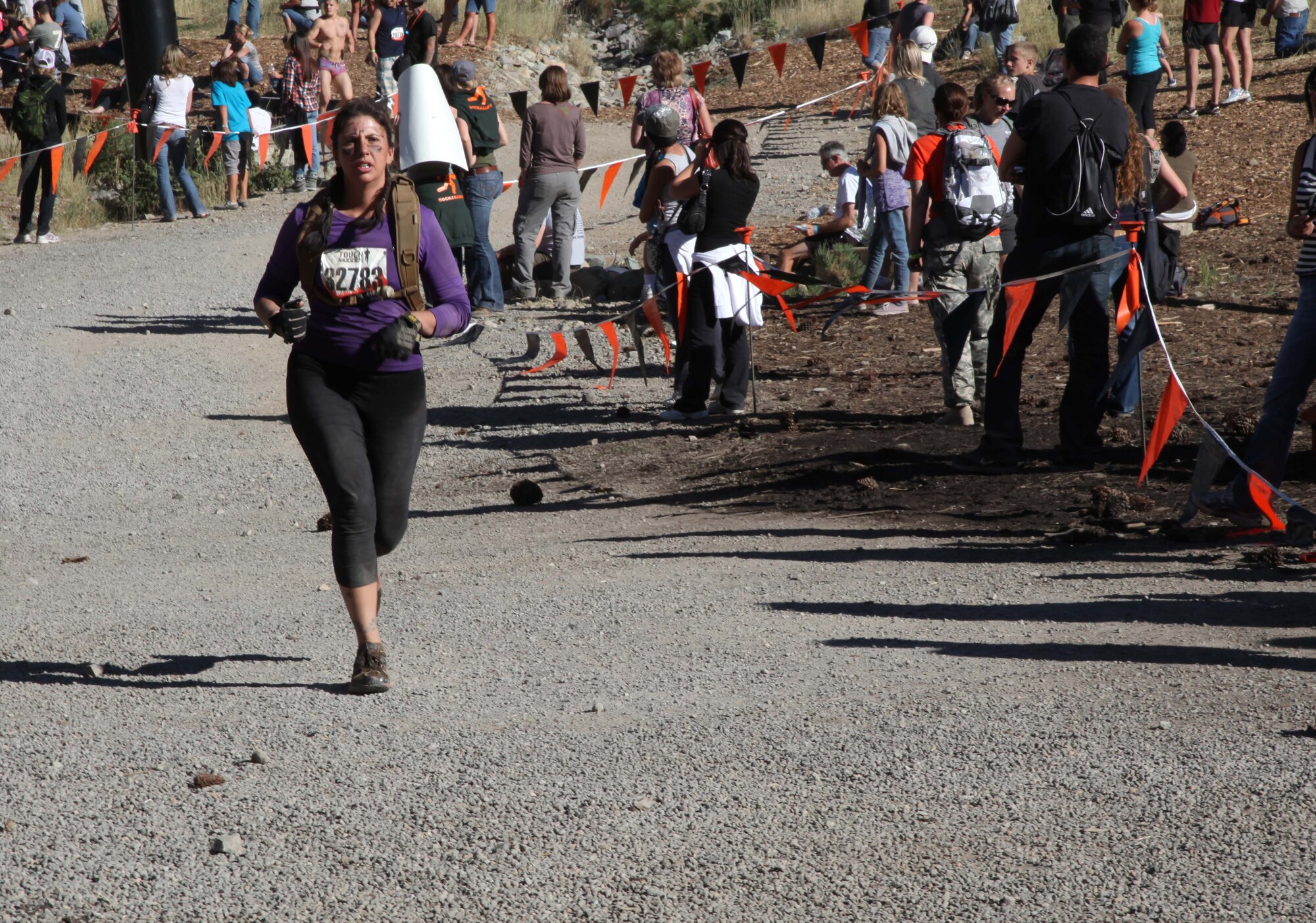 Senior Airman Melissa Parent, a 940th Civil Engineering Squadron Reservist from Beale Air Force Base, rounds the corner on the final stage of the course at Tough Mudder 2011.  More than 17,500 participated in the 2-day event, Sept. 17-18, at Squaw Valley Resort in Northern California. The 11-mile trail run, ridden with military-style obstacles designed by British Special Forces, raised funds for the Wounded Warrior Project. (U.S. Air Force photo/Tech. Sgt. Kenneth McCann)
