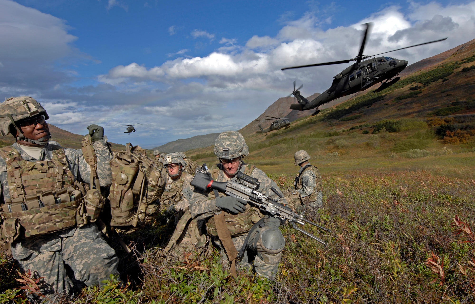 UH-60 Blackhawk helicopters land to pick up Soldiers from 1st Squadron (Airborne), 40th Cavalry Regiment during a training mission near Joint Base Elmendorf-Richardson, Sept. 13. The mission consisted of an air assault, security operations and setting up observation posts. The Soldiers are training in preparation for a deployment to Afghanistan later this year. (U.S. Air Force photo/Staff Sgt. Brian Ferguson)(Released) 