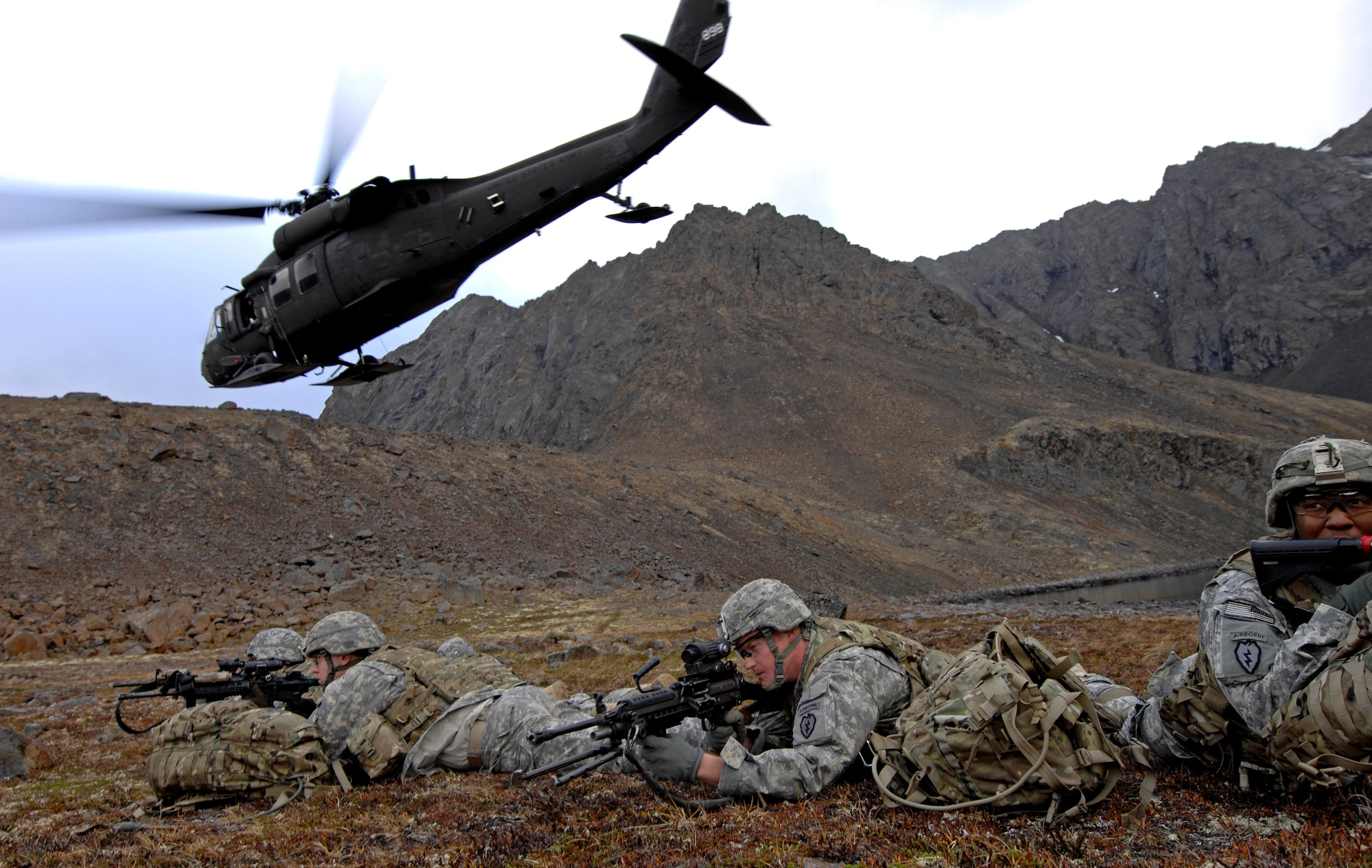 A UH-60 Blackhawk helicopter takes off after dropping off Soldiers from 1st Squadron (Airborne), 40th Cavalry Regiment during a training mission near Joint Base Elmendorf-Richardson, Sept. 13. The mission consisted of an air assault, security operations and setting up observation posts. The Soldiers are training in preparation for a deployment to Afghanistan later this year. (U.S. Air Force photo/Staff Sgt. Brian Ferguson)(Released) 