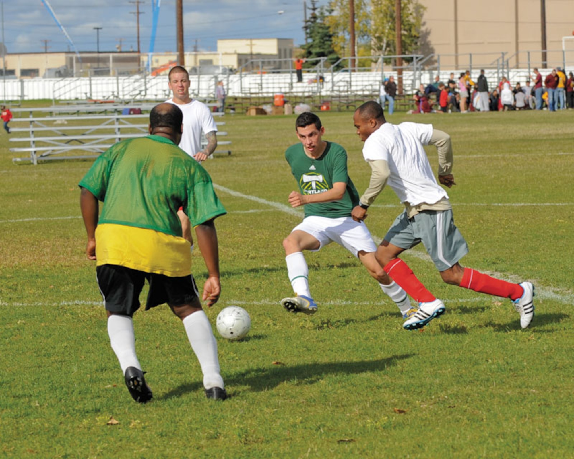 Justin Goodwin and Nicholas Gowdie try to intercept a 725th BSB Soldier’s play. The Soldiers won the Joint Base Elmendorf-Richardson soccer tournament overall, taking top honors for the year’s soccer season. (U.S. Air Force photo/Steven White)