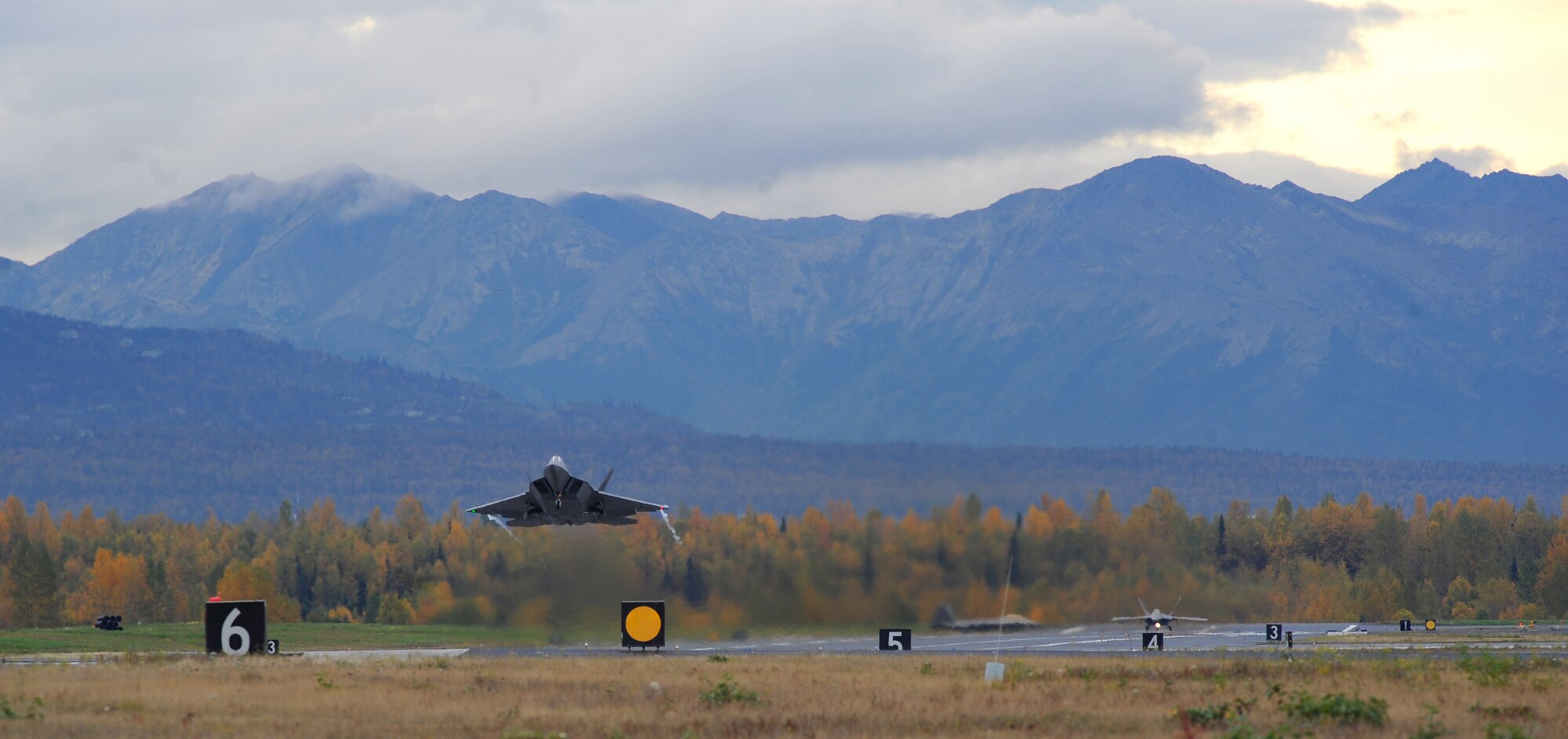 An F-22 Raptor takes off from Joint Base Elmendorf-Richardson, Alaska, Sept. 21, after a four month stand-down. Secretary of the Air Force Michael Donley and Chief of Staff Gen. Norton Schwartz recently approved an implementation plan developed by Air Combat Command officials that will allow the F-22 to resume flight operations. The commander of ACC directed a stand-down of the fleet May 3 as a safety precaution, following 12 separate reported incidents where pilots experienced hypoxia-like symptoms. (US Air Force photo/Senior Airman Cynthia Spalding)