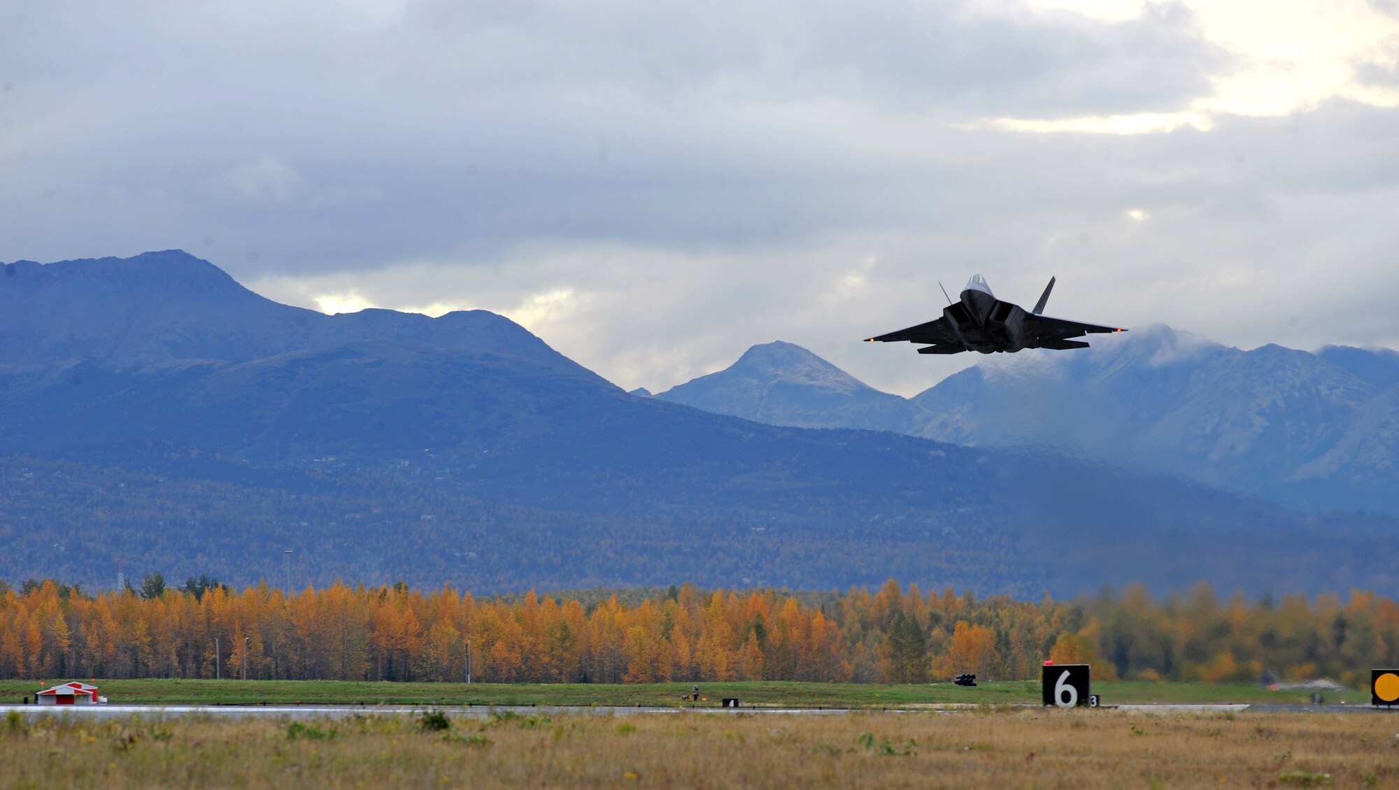 An F-22 Raptor takes off from Joint Base Elmendorf-Richardson, Alaska, Sept. 21, after a four month stand-down. Secretary of the Air Force Michael Donley and Chief of Staff Gen. Norton Schwartz recently approved an implementation plan developed by Air Combat Command officials that will allow the F-22 to resume flight operations. The commander of ACC directed a stand-down of the fleet May 3 as a safety precaution, following 12 separate reported incidents where pilots experienced hypoxia-like symptoms. (US Air Force photo/Senior Airman Cynthia Spalding)