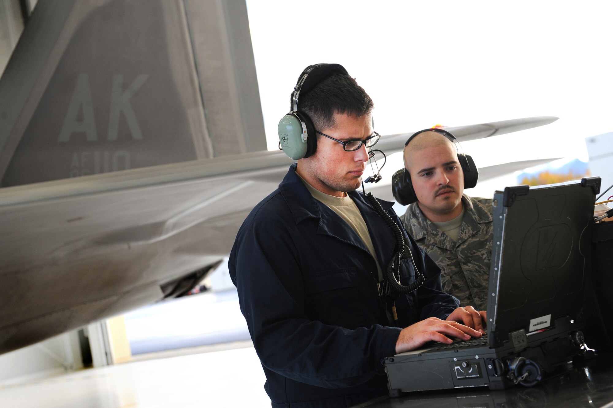 Crew chiefs with the 525th Fighter Squadron prepare an F-22 Raptor for take off from Joint Base Elmendorf-Richardson, Alaska, Sept. 21, after a four month stand-down. Secretary of the Air Force Michael Donley and Chief of Staff Gen. Norton Schwartz recently approved an implementation plan developed by Air Combat Command officials that will allow the F-22 to resume flight operations. The commander of ACC directed a stand-down of the fleet May 3 as a safety precaution, following 12 separate reported incidents where pilots experienced hypoxia-like symptoms. (US Air Force photo/Senior Airman Cynthia Spalding)