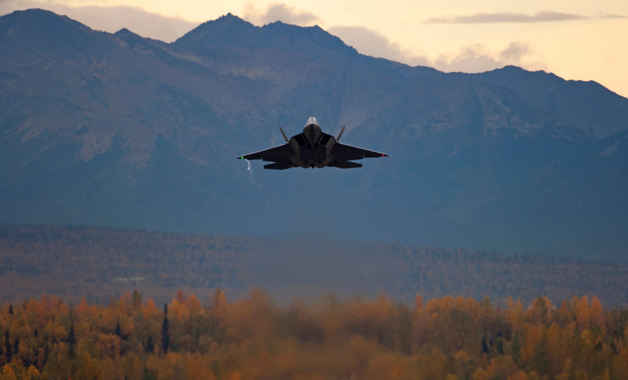 An F-22 Raptor takes off from Joint Base Elmendorf-Richardson, Alaska, Sept. 21, after a four-month stand down.  Secretary of the Air Force Michael Donley and Chief of Staff Gen. Norton Schwartz recently approved an implementation plan developed by Air Combat Command officials that will allow the F-22 to resume flight operations. The commander of Air Combat Command directed a stand-down of the fleet May 3 as a safety precaution, following 12 separate reported incidents where pilots experienced hypoxia-like symptoms. (U.S. Air Force photo/Staff Sgt. Brian Ferguson)
