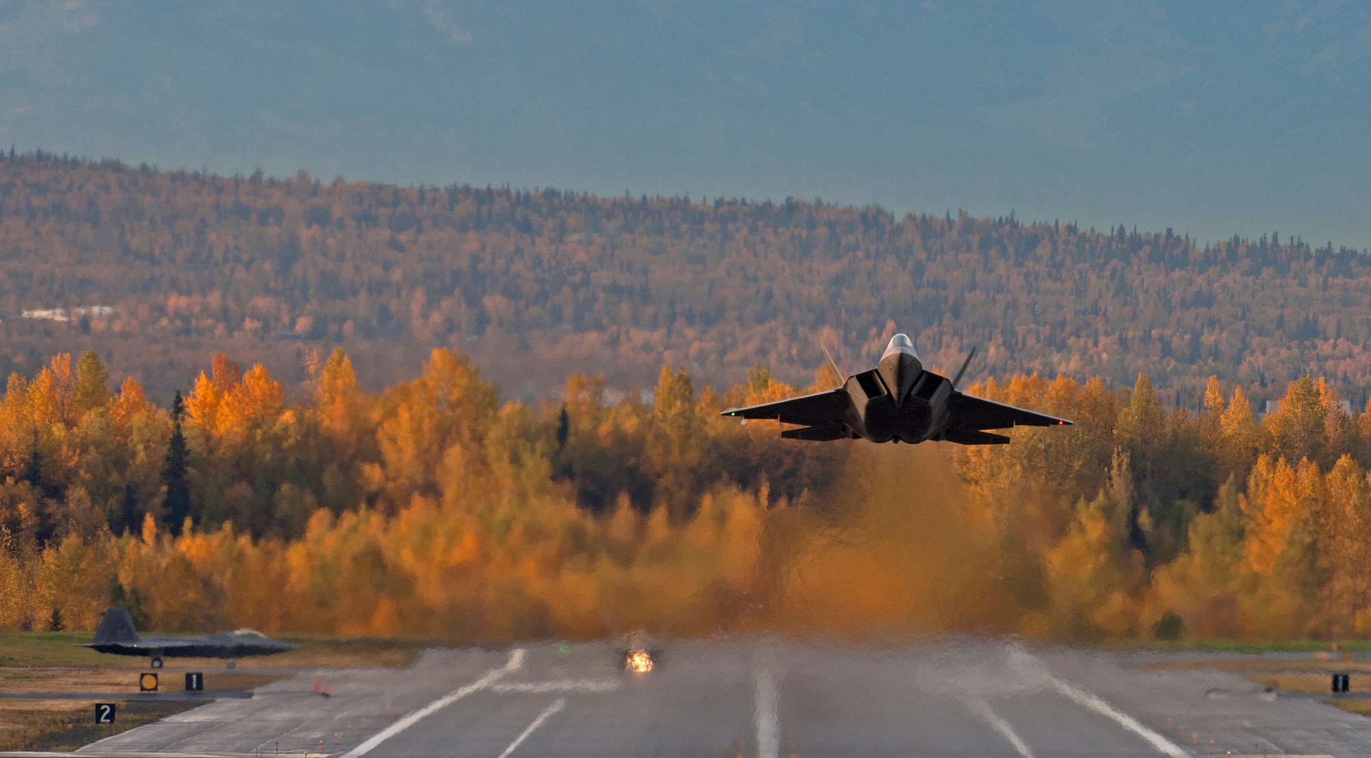 An F-22 Raptor takes off from Joint Base Elmendorf-Richardson, Alaska, Sept. 21, after a four-month stand down.  Secretary of the Air Force Michael Donley and Chief of Staff Gen. Norton Schwartz recently approved an implementation plan developed by Air Combat Command officials that will allow the F-22 to resume flight operations. The commander of Air Combat Command directed a stand-down of the fleet May 3 as a safety precaution, following 12 separate reported incidents where pilots experienced hypoxia-like symptoms. (U.S. Air Force photo/Staff Sgt. Brian Ferguson)