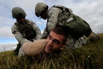 MINOT AIR FORCE BASE, N.D. – 91st Security Forces Group response team members apprehend exercise aggressors as part of the second annual Global Strike Challenge tryouts at the U-01 training center here Sept. 21. The GSC is a competition where Air Force Intercontinental Ballistic Missile and bomber forces compete against one another to be recognized as the best at what they do in the command. The challenge will be held at Barksdale AFB, La. (U.S. Air Force Photo / Airman 1st Class Stephanie Ashley)