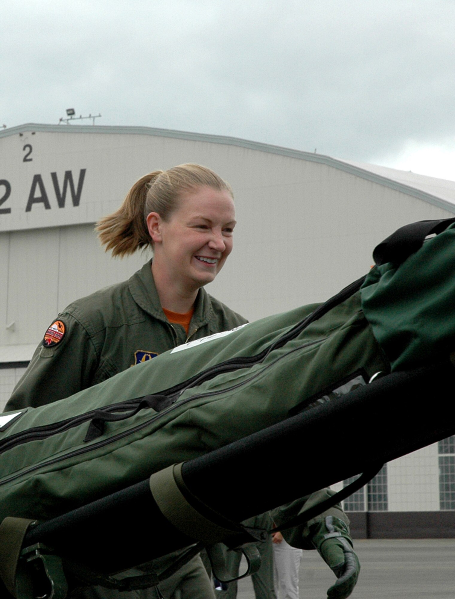 Then-Senior Airman Krystil Reinstadler enjoys the cheers from spectators during Air Mobility Command's Rodeo at McChord Field, Wash, July 26.  Now a staff sergeant, Reinstadler, 446th Aeromedical Evacuation Squadron here, is one of six in the aeromedical evacuation career field to attend the 2011 Air Force Association Convention Sept. 18 to accept the David C. Schilling Award on behalf of the Air Force aeromedical evacuation community. Lt. Col. Michael Gainer, 446th AES, also represented AE in accepting the award. (U.S. Air Force photo by Sandra Pishner)