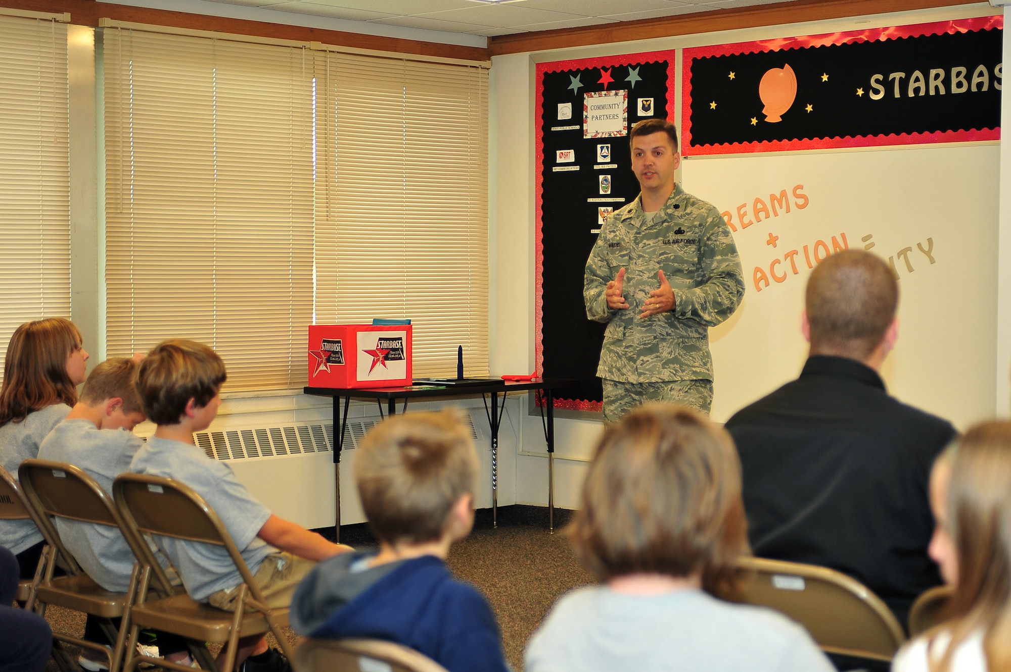 MINOT AIR FORCE BASE, N.D. – Lt. Col. Sean Wade, 5th Logistics Readiness Squadron commander, speaks to the first class to graduate under the STARBASE North Dakota program, a premiere Department of Defense education program at the North Plains Elementary School here, Sept. 20. The curriculum of the DoD STARBASE Program is designed for fifth-grade students and is based on national standards. STARBASE is sponsored by the Office of the Assistant Secretary of Defense, providing students with 20-25 hours of stimulating experiences with bases of all services across the. (U.S. Air Force Photo / Senior Airman Jesse Lopez)
