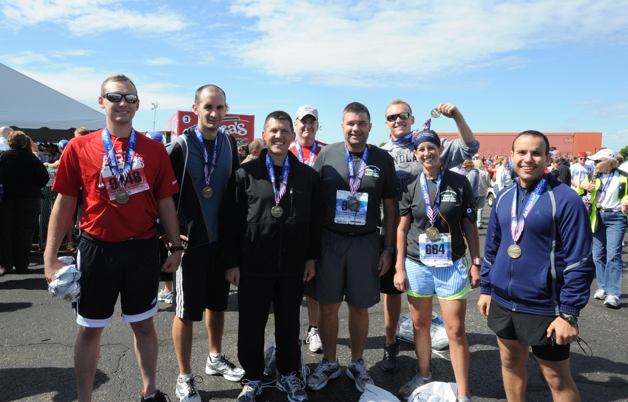 Team McConnell runners pose with their medals after completing events at the Air Force Marathon Sept. 17, 2011, Wright-Patterson Air Force Base, Kan.  Twenty-six Team McConnell members ran the 10 kilometer race, half marathon or full marathon at the 15th annual event. (U.S. Air Force photo by Airman 1st Class Laura L. Valentine)