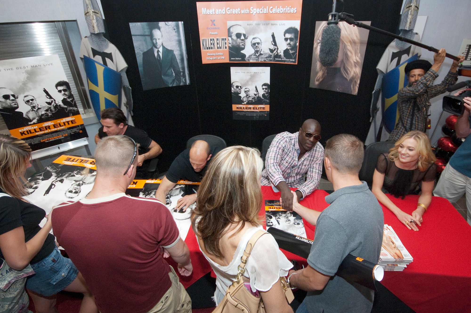 The “Killer Elite” cast members signed autographs for recently deployed servicemembers and family members of those deployed in the Public Affairs and Multimedia building for about an hour and a half before moving to the base theater for a free pre-release showing of the action film. (Air Force photo by Rob Densmore)