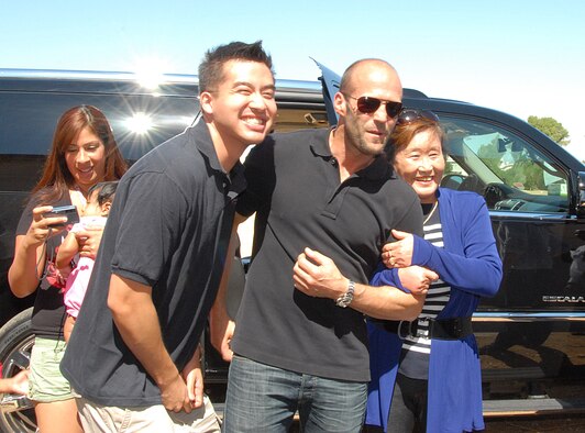 Jason Statham poses with Team Edwards members. After the actors introduced the free showing, fans came outside to get a glimpse of the actors up close and pose for some candid photos. (Air Force photo by Kenji Thuloweit)