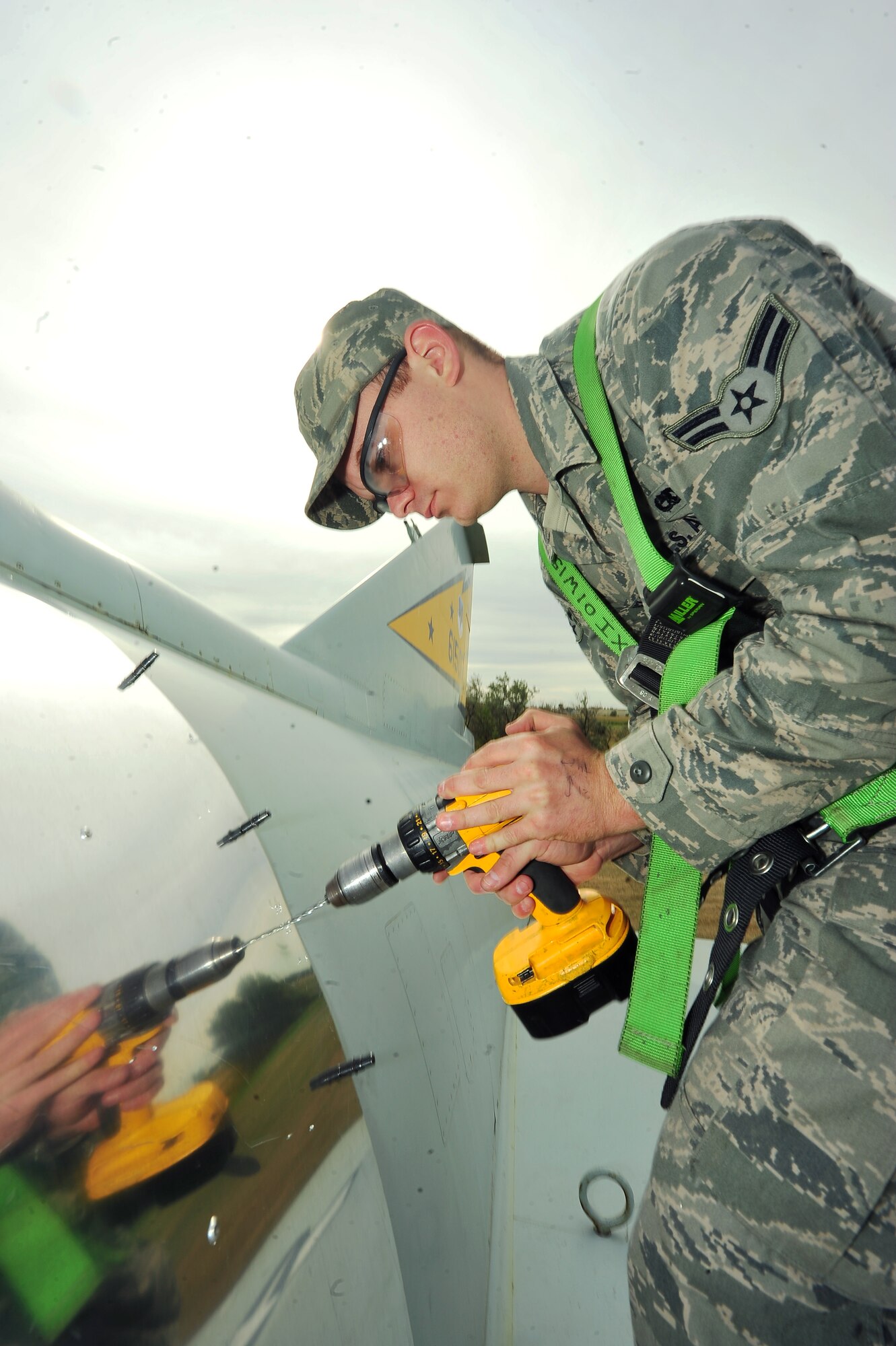 MINOT AIR FORCE BASE, N.D. – Airman 1st Class David Bellone, 5th Maintenance Squadron sheet metal apprentice, repairs a static display aircraft here Sept. 19. The perseveration of these historic aircraft enables the proud traditions of the Air Force’s heritage to live on. (U.S. Air Force Photo / Senior Airman Jesse Lopez)

