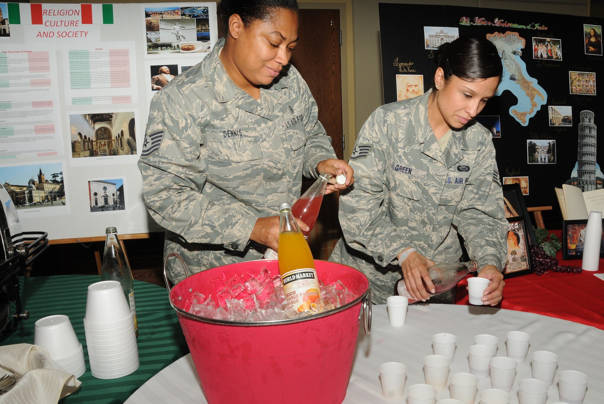 Tech. Sgt. Kristal Dennis, left, 81st Aerospace Medicine Squadron, and Staff Sgt. April Green, 2nd Air Force, pour samples of Italian soda for guests to enjoy at Diversity Day, Sept. 13 at the Bay Breeze Event Center.  The cultural celebration also included music, literature, dancing, poetry, face painting, games and food for children and adults.  (U.S. Air Force photo by Kemberly Groue)