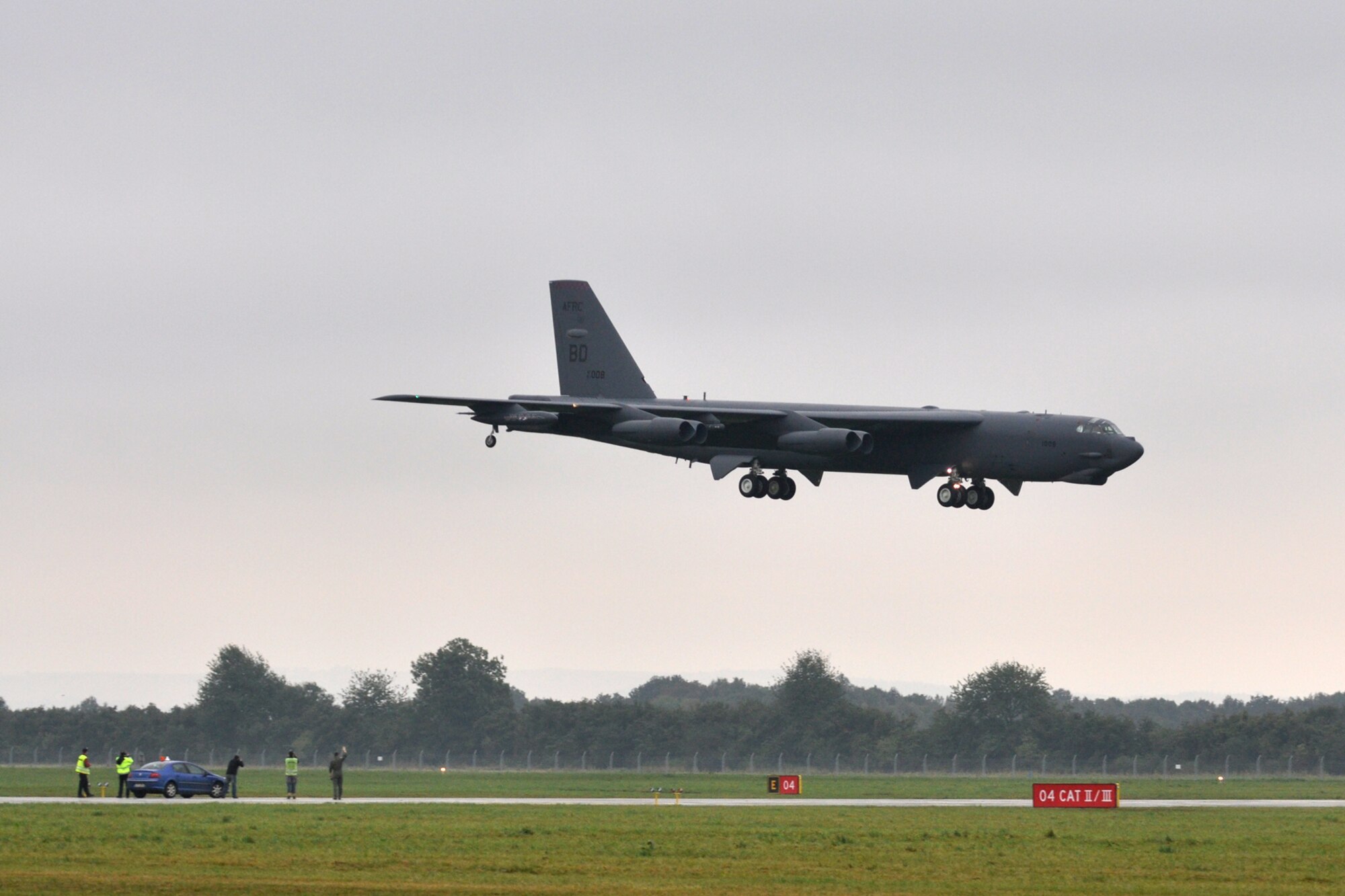 Capt. Casey Gough, 93rd Bomb Squadron pilot, waves to the crew of a B-52 Stratofortress as they prepare to land at the Ostrava Airport in the Czech Republic, Sept. 20, 2011. The B-52, from the 93rd Bomb Squadron, 307th Bomb Wing, Barksdale Air Force Base, La., arrived in the Czech Republic to participate in the North Atlantic Treaty Organization Days in Ostrava air show, which is scheduled for Sept. 24-25, 2011, at the Leos Janacek Ostrava Airport, Ostrava, Czech Republic. (U.S. Air Force photo by Tech. Sgt. Jeff Walston/Released)