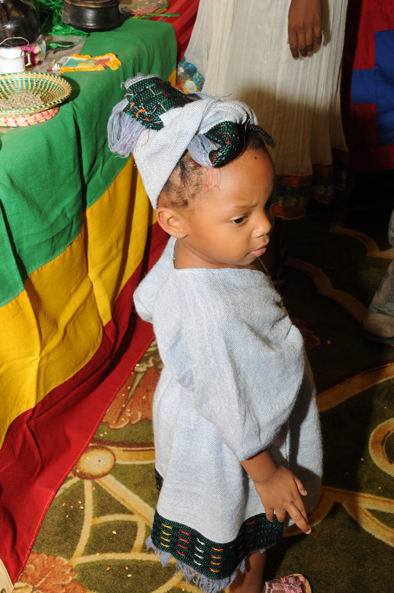 Three-year-old Soliy Nesmith wears a traditional Ethiopian dress and turban at Diversity Day, Sept. 13 at the Bay Breeze Event Center.  Her parents are Mery and Aerographer's Mate 1st Class Harvey Nesmith from Stennis Space Center in Hancock County. The cultural celebration also included music, literature, dancing, poetry, face painting, games and food for children and adults.   (U.S. Air Force photo by Kemberly Groue)
