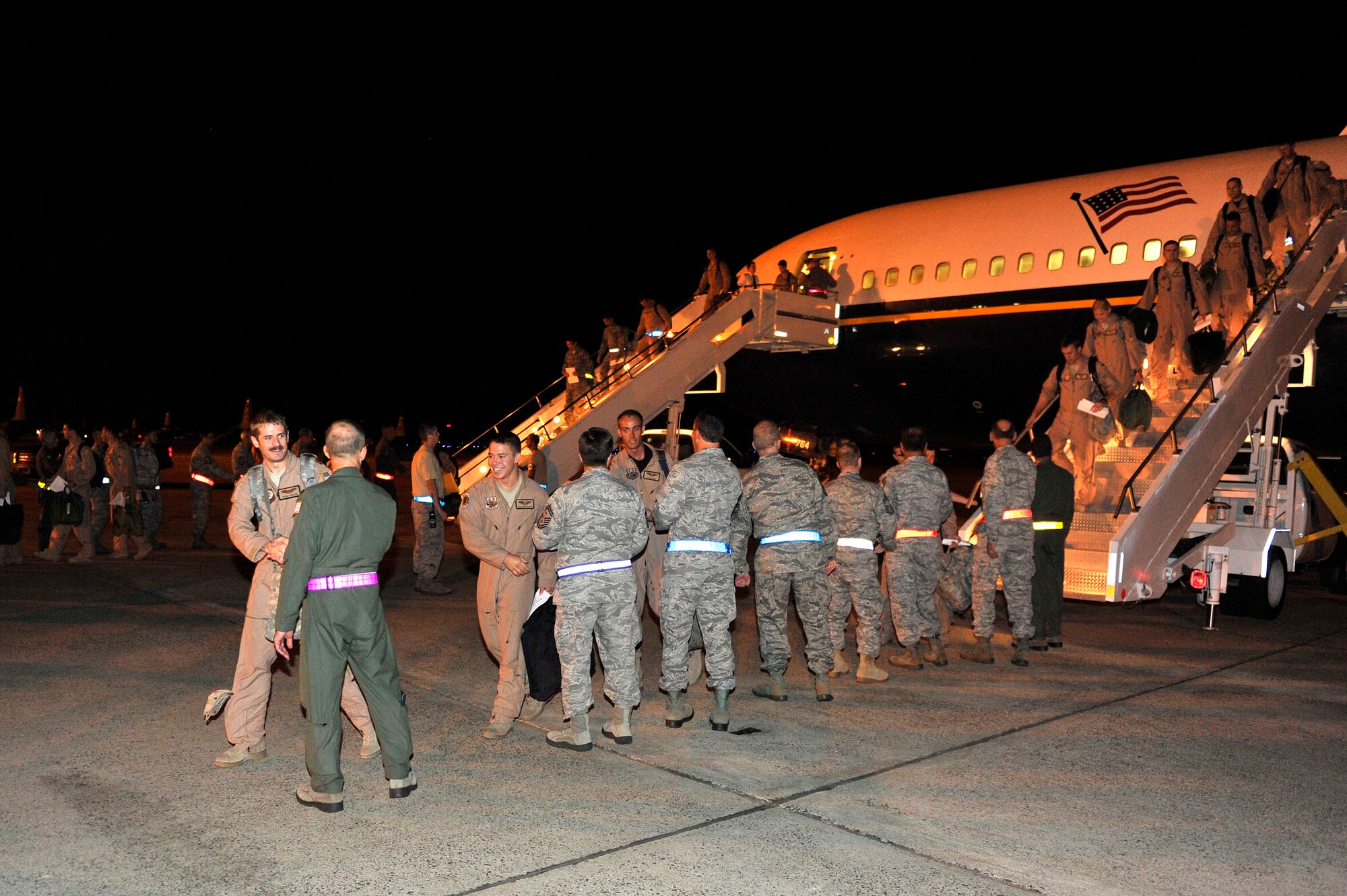 More than 120 Team Little Rock Airmen returned home from deployments supporting operations in Southwest Asia Sept. 20, 2011 on Little Rock Air Force Base, Ark.  The military members were met by several wing, group, and squadron leaders as they departed the airplane.  (U.S. Air Force photo by Staff Sgt. Chris Willis)