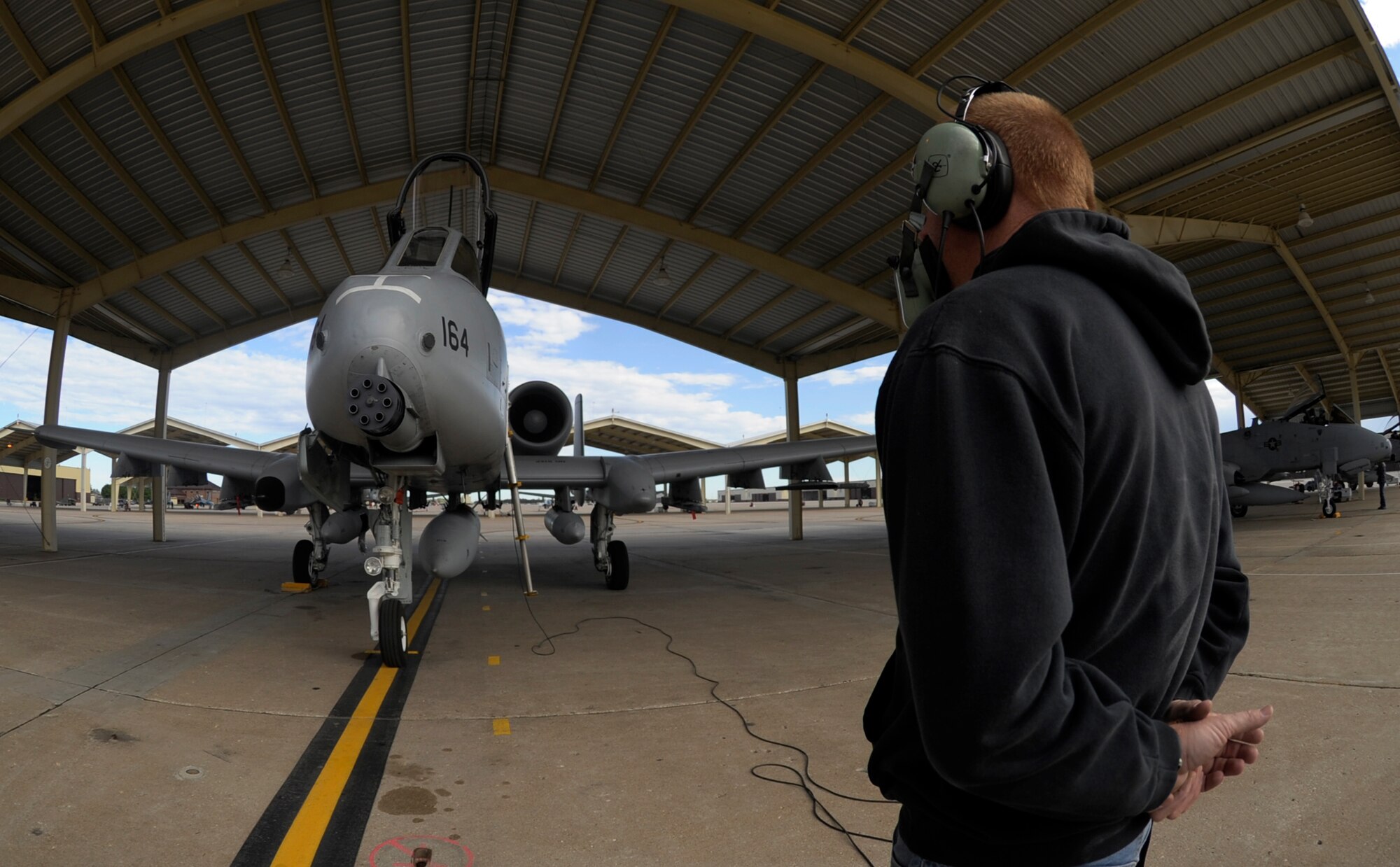 WHITEMAN AIR FORCE BASE, Mo. - Ken Campbell, 442nd Aircraft Maintenance Squadron crew chief, marshals an A-10 Thunderbolt II before it flies to Selfridge Air National Guard Base, Mich. Sept. 21 to support the base while its members are deployed to a forward operating base in Afghanistan. Approximately 20 maintainers from the 442nd Fighter Wing deployed to Afghanistan in September for a six-month deployment where they will support the Michigan Air National Guard through aircraft maintenance and operations. Nearly 300 more reservists from the 442nd FW are scheduled to deploy to the area of responsibility in January 2012. (U.S. Air Force photo by Senior Airman Cody H. Ramirez)