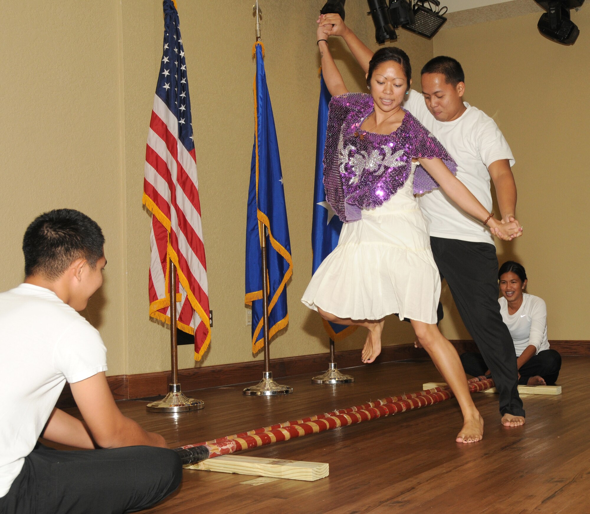 From left, Senior Airman Mark Lagman, Airman 1st Class Rocas Randolph, Senior
Airman Reney Samson and Staff Sgt. Monik Oubina perform a Filipino dance called tinikling at Diversity Day, Sept. 13 at the Bay Breeze Event Center. The cultural
celebration also included music, literature, poetry, face painting, games and food for
children and adults. Lagman, Randolph and Samson are from the 81st Diagnostics and Therapeutics Squadron and Oubina is from the 81st Force Support Squadron.
(U.S. Air Force photo by Kemberly Groue)