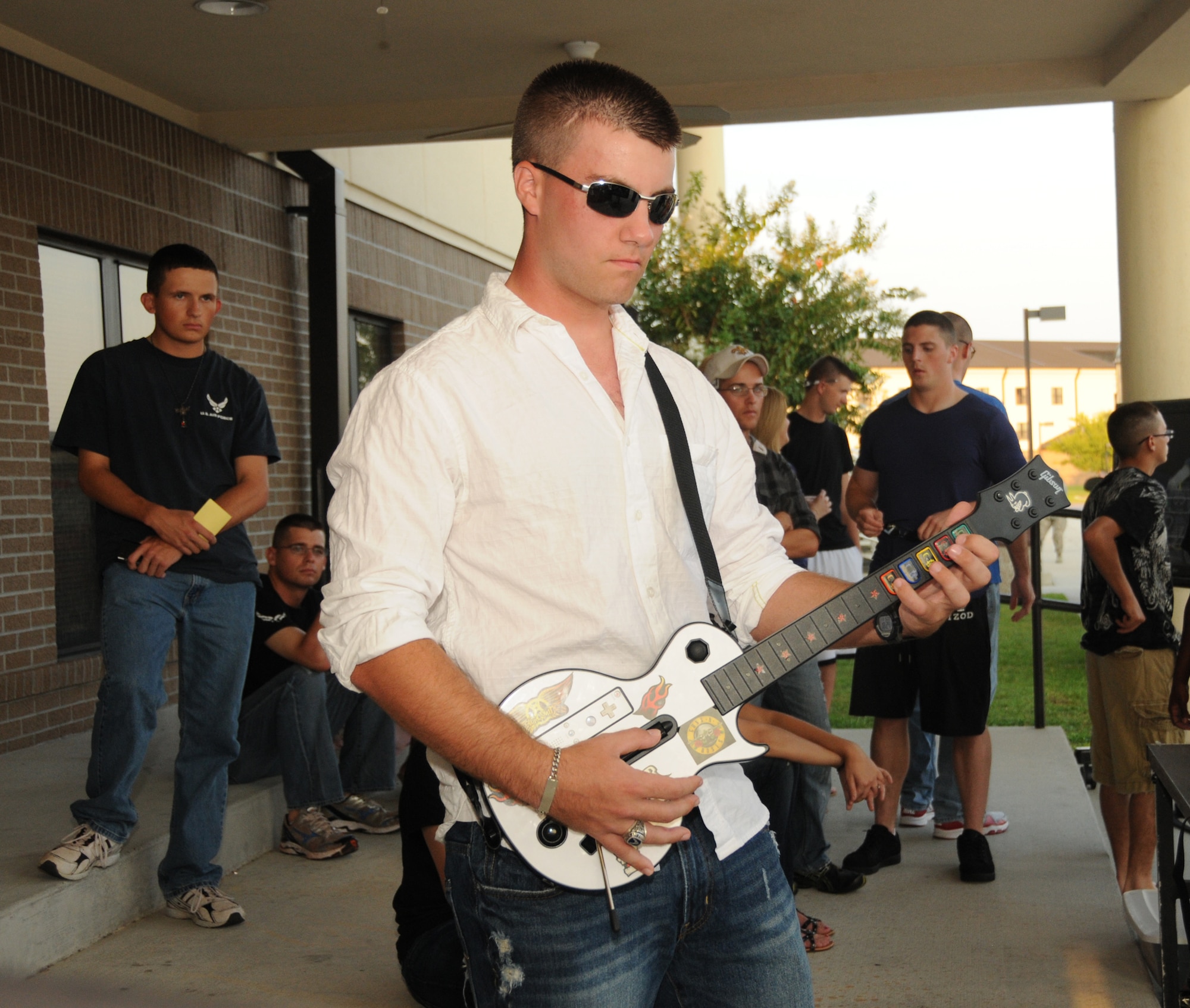 Airman Basic Cody Purvis, 334th Training Squadron student, demonstrates his talent in the Guitar Hero competition at the Air Force birthday celebration Sept. 16 on the parade grounds.  (U.S. Air Force photo by Kemberly Groue)