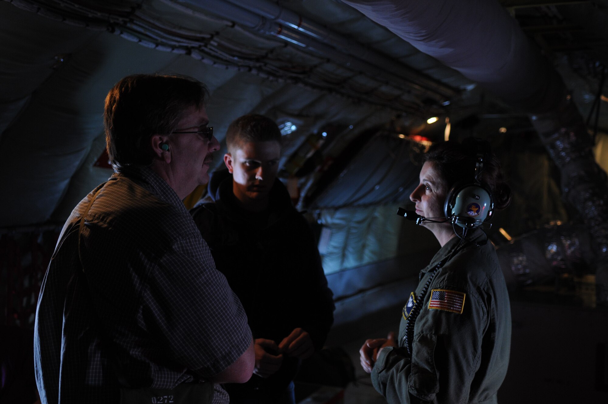 GRISSOM AIR RESERVE BASE, Ind. -- Duane Arndt, special assistant for Congressman Joe Donnelly, and Nick Bock, case manager for Congressman Joe Donnelly talk with Senior Master Sgt. Laura McKee, 72 Air Refueling Squadron in-flight refueling technician, during a refueling mission. Congressional staff members get an opportunity to see first-hand an air refueling mission aboard a KC-135R Stratotanker Sept. 14. Arndt and Bock were two of the nine staffers on board. The purpose of their visit was to give the staffers the opportunity to learn about the impact Grissom has not only in helping preserve America's freedom but the economic value that it has on the surrounding community. (U.S. Air Force photo/Senior Airman Jami K. Lancette) 