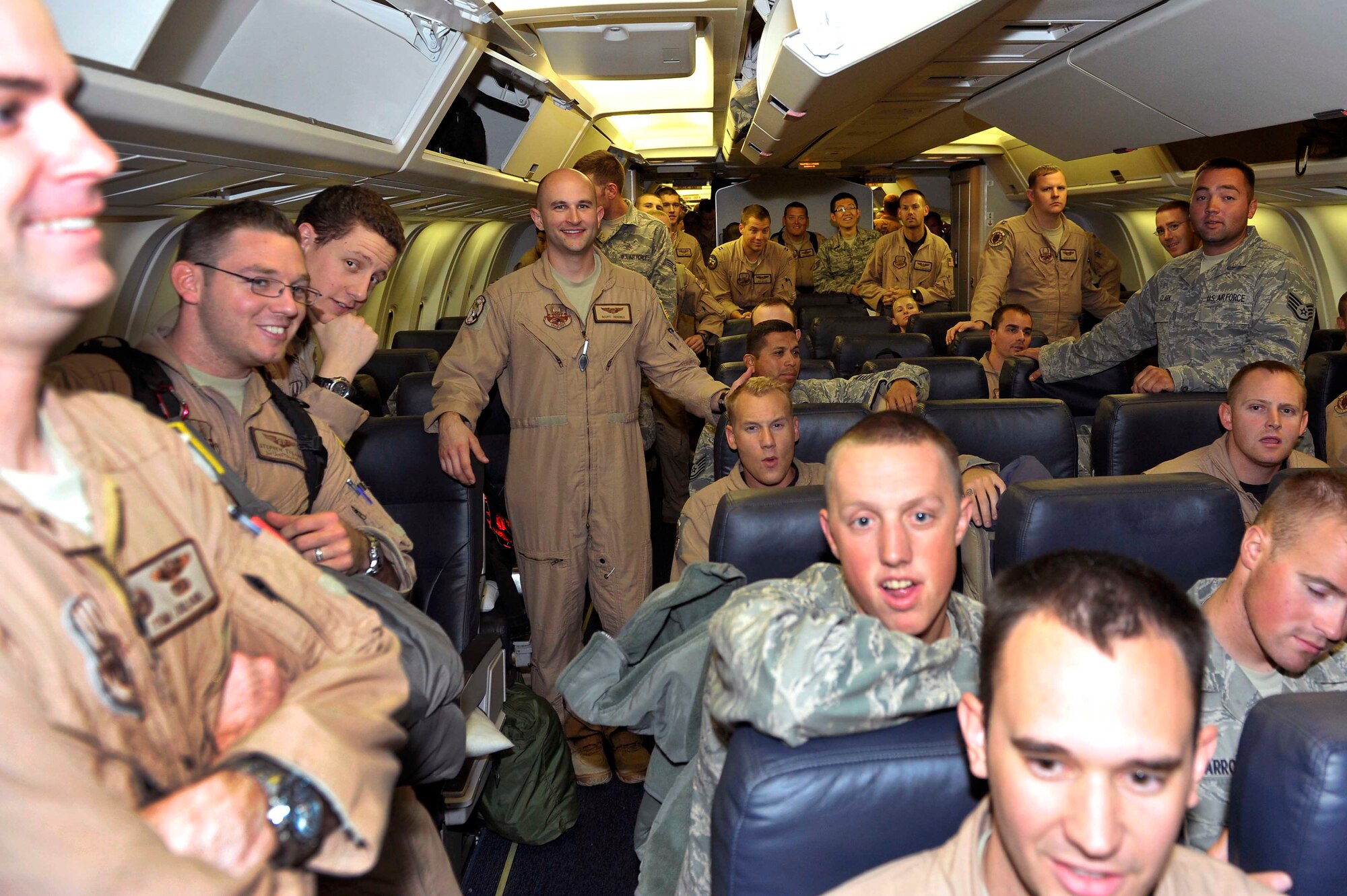 More than 120 Team Little Rock Airmen returned home Sept. 20, 2011, at Little Rock Air Force Base, Ark. Wing leadership, families and friends assembled outside to greet the returning warriors as soon as they returned from deployments supporting operations in Southwest Asia. (U.S. Air Force photo by Staff Sgt. Chris Willis) 