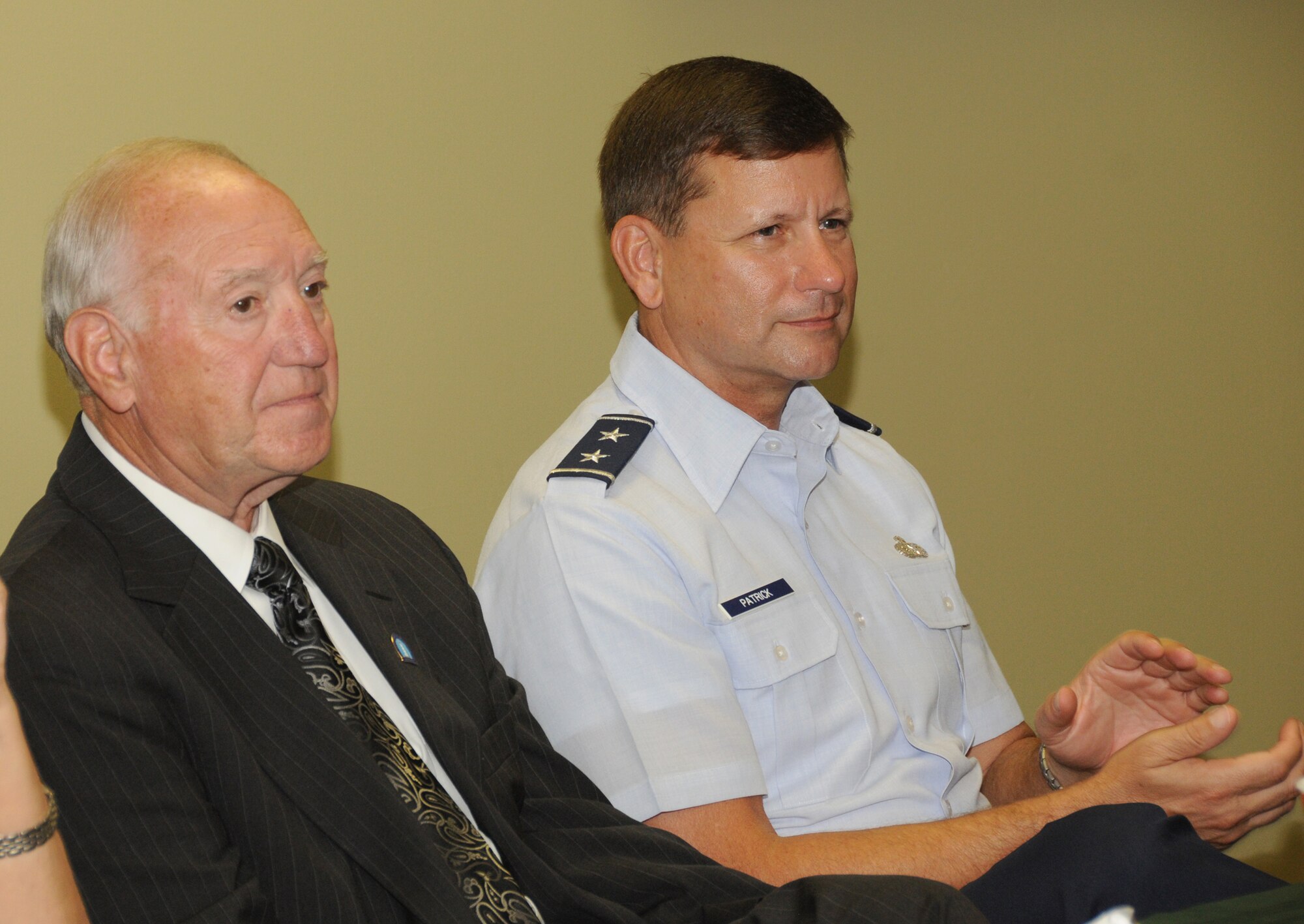 Biloxi Mayor A.J. Holloway and Maj. Gen. Len Patrick listen to Stephen Witt, director of the Innovation Center, during the Biloxi Chamber of Commerce “Breakfast with the Mayor” Sept. 14. The event is held at various Biloxi locations and gives the mayor an
opportunity to give updates on city issues and projects to community leaders. A
special welcome was given to Patrick, who assumed command of 2nd Air Force July 21 and pinned on his new rank Sept. 2.  (U.S. Air Force photo by Kemberly Groue)