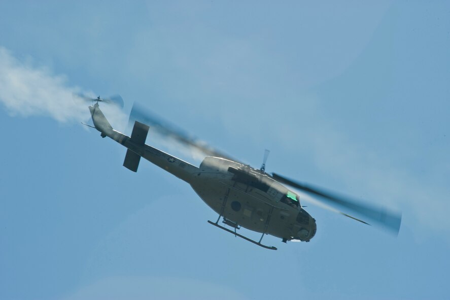A U.S. Marine Corps UH-1N Huey from Marine Light Attack Helicopter Squadron 467 fires a missile during Exercise Atlantic Strike 11-02 at Avon Park Air Force Range, Fla., Sept. 14, 2011. Atlantic Strike is an exercise tailored to close-air support and showcases air power from a joint perspective by bringing all services together in one fight. (U.S. Air Force photo by Staff Sgt. Jamal D. Sutter/Released) 
