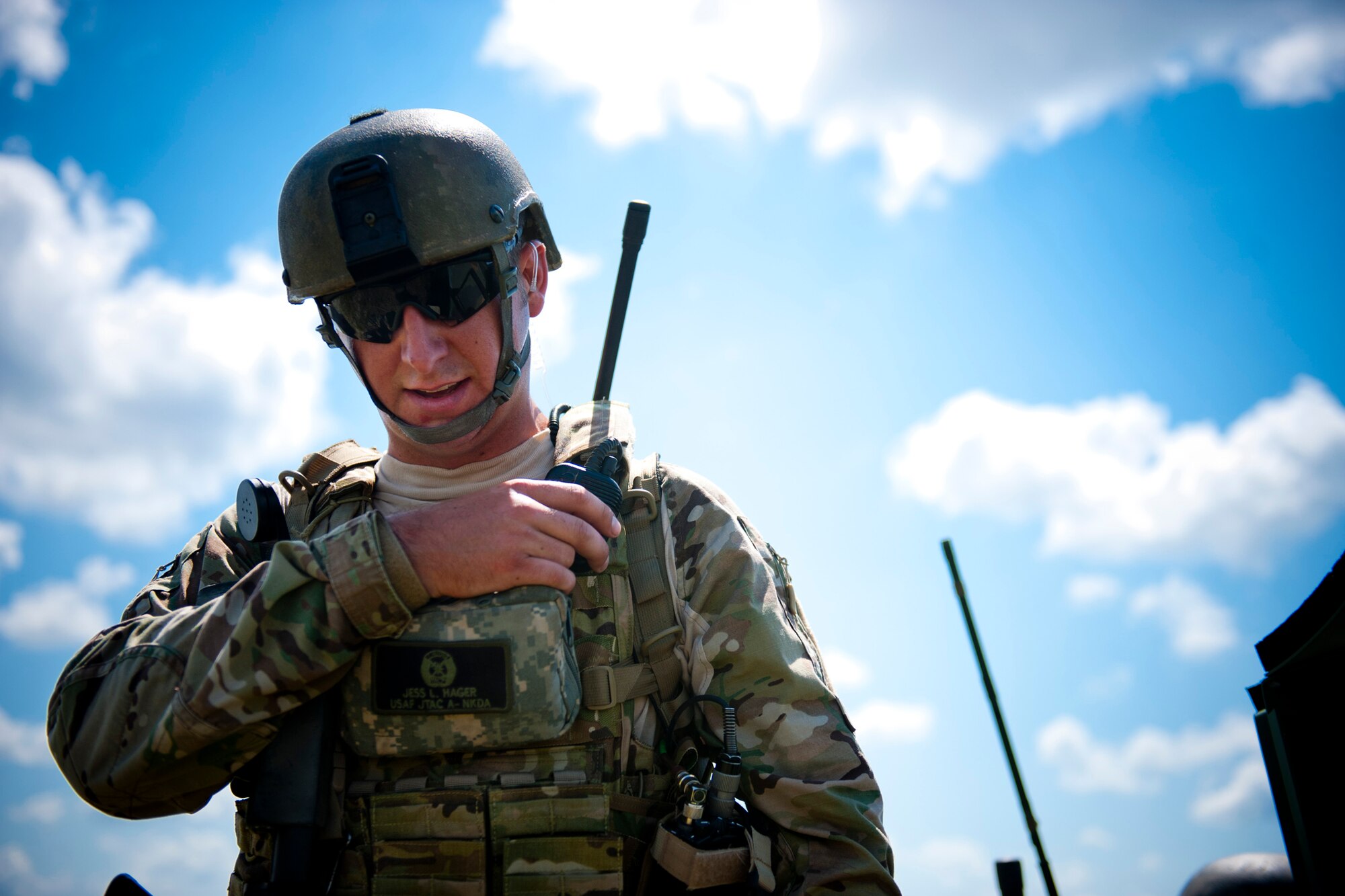 U.S. Air Force Senior Airmen Jess Hager, 11th Air Support Operations Squadron joint terminal attack controller, communicates with an aircrew during Exercise Atlantic Strike 11-02 at Avon Park Air Force Range, Fla., Sept. 14, 2011. JTACs communicate directly with aircrews to ensure they accurately hit targets without harming ally forces during the process. (U.S. Air Force photo by Staff Sgt. Jamal D. Sutter/Released)