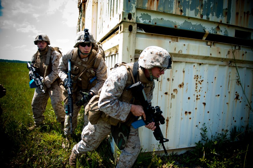 U.S. Marine Corps members of the 2nd Tank Battalion out of Marine Corps Base Camp Lejeune, N.C., maneuver for better positioning during Exercise Atlantic Strike 11-02 at Avon Park Air Force Range, Fla., Sept. 13, 2011. The Marines provided a ground forces element to the exercise which primarily focuses on close-air support. U.S. Air Force Tactical Air Control-Parties worked directly with the ground force to eliminate targets and meet objectives, something not seen in most other joint exercises. (U.S. Air Force photo by Staff Sgt. Jamal D. Sutter/Released)
