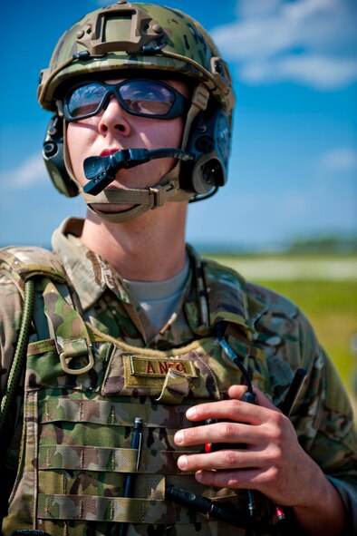 U.S. Air Force Senior Airmen William Camp, 113th Air Support Operations Squadron joint terminal attack controller, communicates with an aircrew during Exercise Atlantic Strike 11-02 at Avon Park Air Force Range, Fla., Sept. 13, 2011. Camp, who is currently in upgrade training, was evaluated on his ability to accurately direct air strikes and help place bombs on target. (U.S. Air Force photo by Staff Sgt. Jamal D. Sutter/Released)
