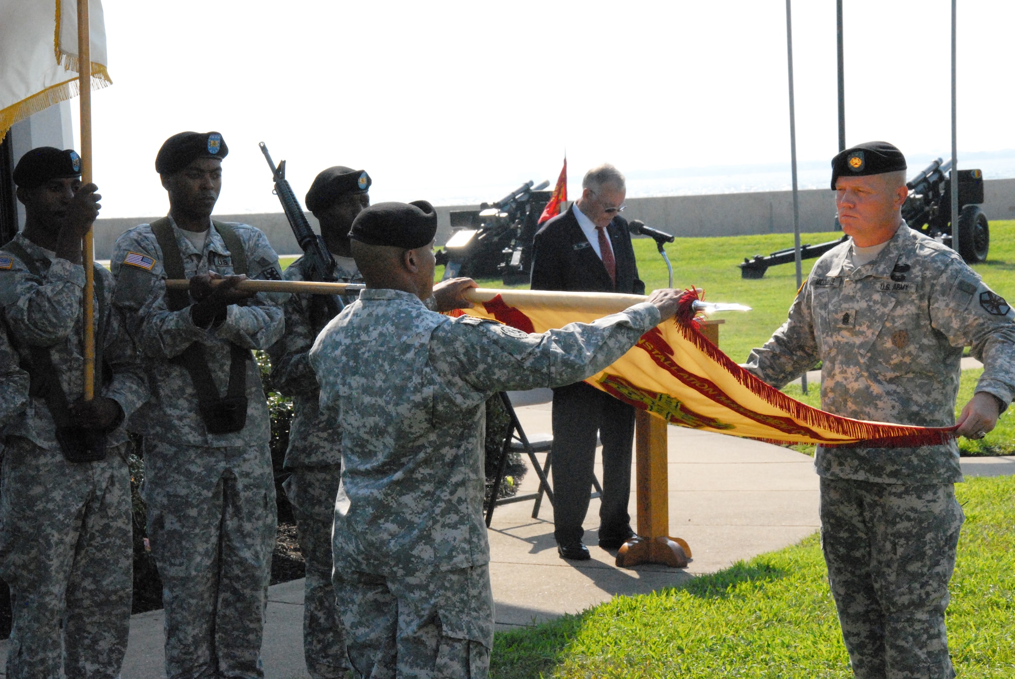 (From left) Fort Monroe Garrison Commander Col. Anthony D. Reyes and Command Sgt. Maj. Lesly McCorkle furl the garrison colors for final casing at Fort Monroe's deactivation ceremony Sept. 15. The historic fort, known as "Freedom's Fortress," deactivated after 188 years of service. (U.S. Army photo by Sid Lilly/Released)