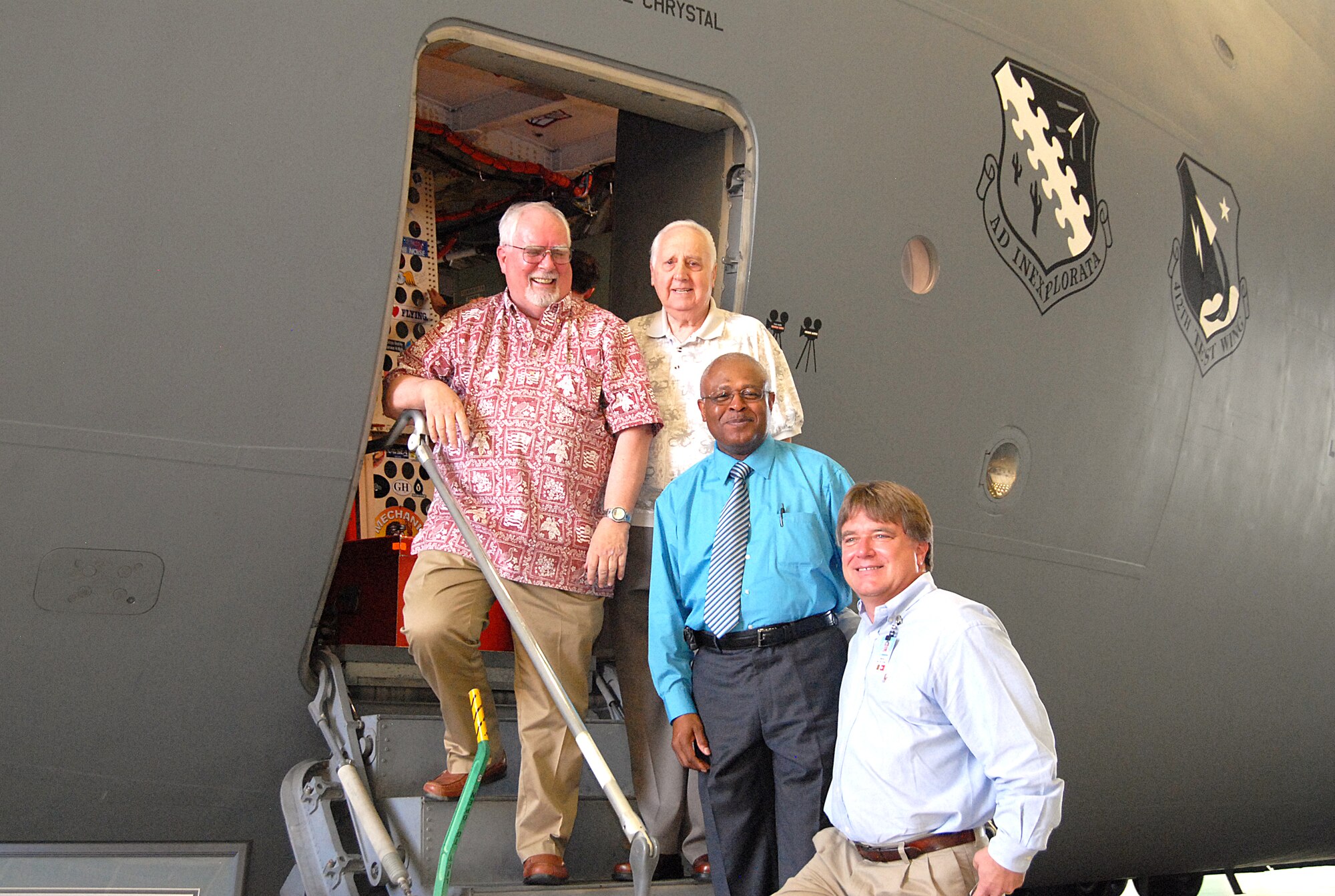 The flight crew for the C-17’s first flight – which took place Sept. 15, 1991 – climbs aboard T-1 for one last time. Edwards held a ceremony in Hangar 1623 to commemorate the first flight.  Pictured: pilot Bill Casey (top left); loadmaster Ted Venturini (top right); co-pilot George London (center); and flight test engineer Henry Van De Graf (bottom step). (Air Force photo by Diane Betzler)