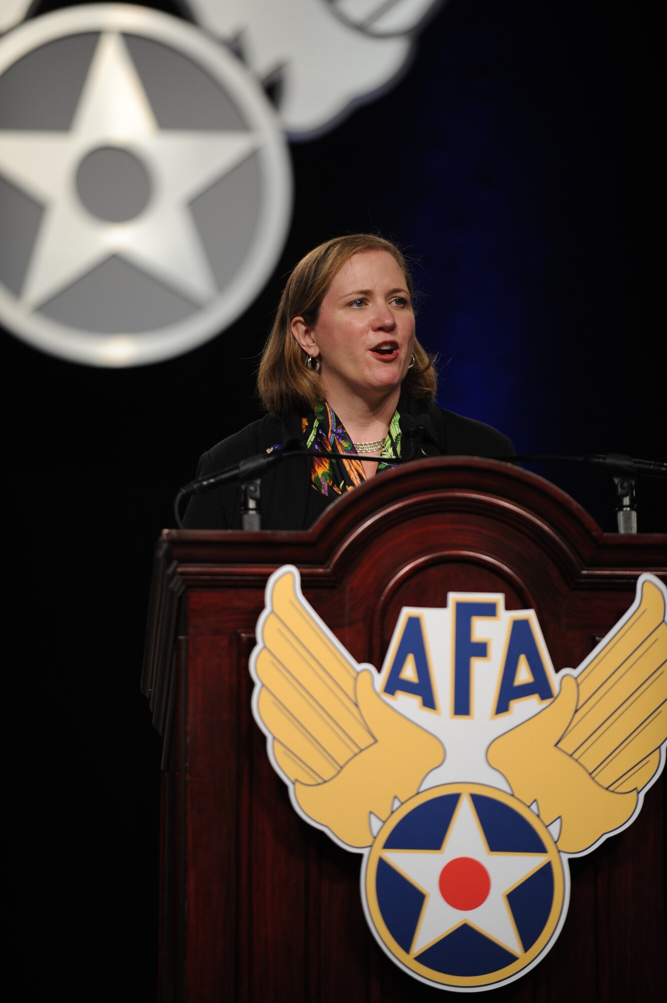 Under Secretary of the Air Force Erin Conaton addresses Airmen, interagency partners and industry leaders Sept. 20, 2011, about strategic opportunities and the need for innovation in the current fiscal environment during the Air Force Association's 2011 Air & Space Conference and Technology Exposition at National Harbor, Md. (U.S. Air Force photo/Master Sgt. Thomas A. Coney)
