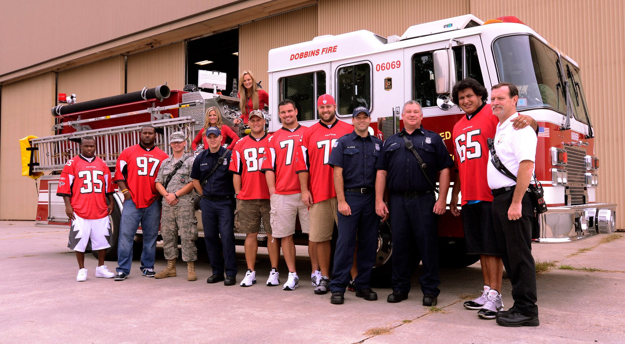 Atlanta Falcons football team members pose with 94th Airlift Wing firefighters at Dobbins Air Reserve Base, Sept. 20. The football team members visited to Dobbins to show their appreciation for what the military does every day.   (U.S. Air Force photo/ Brad Fallin)