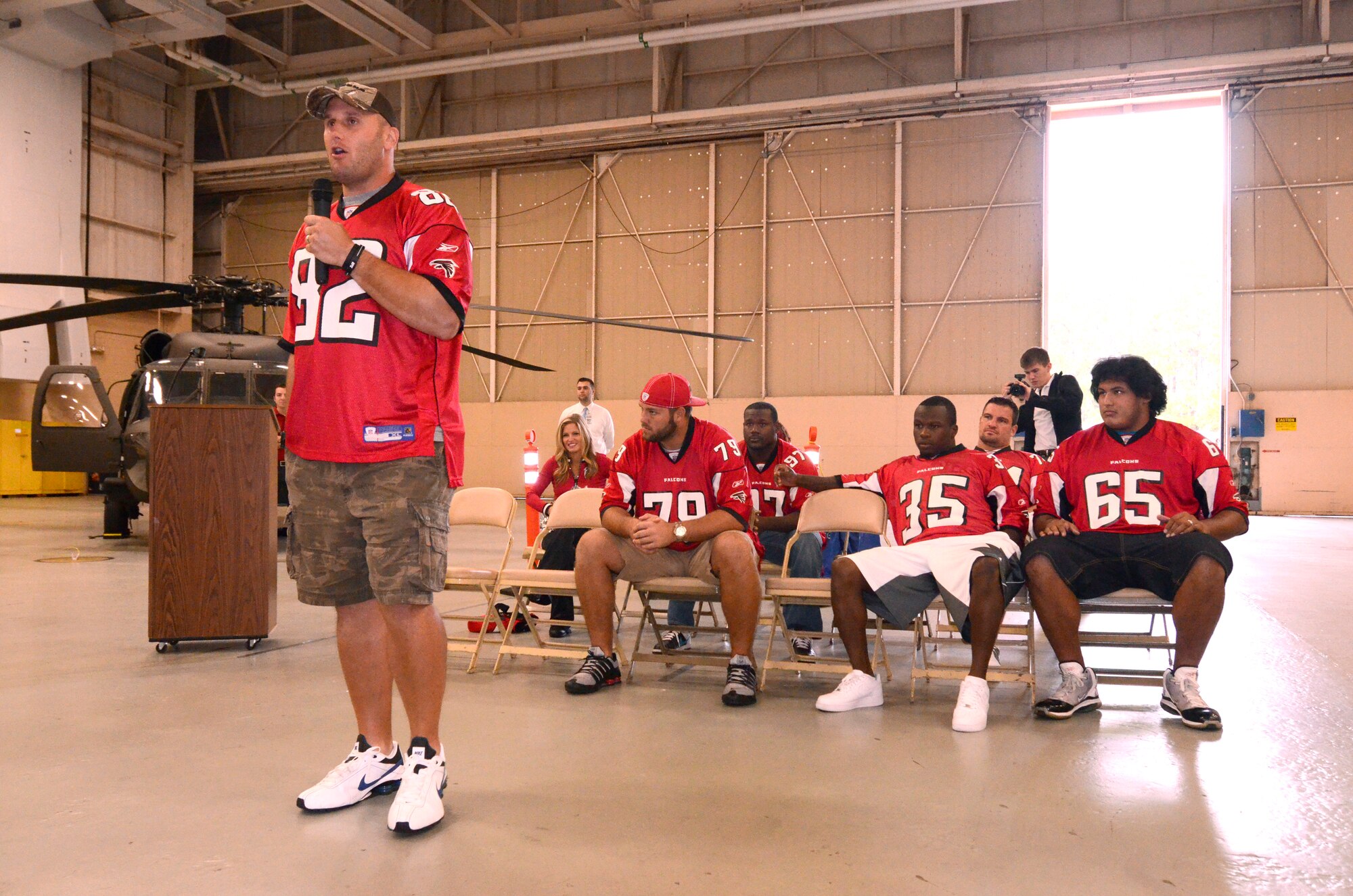 Joe Zelenka of the Atlanta Falcons thanks a crowd of military members for their service at Dobbins Air Reserve Base, Sept. 20. Atlanta Falcons football team members visited to Dobbins to show their appreciation for what the military does every day.   (U.S. Air Force photo/ Brad Fallin)
