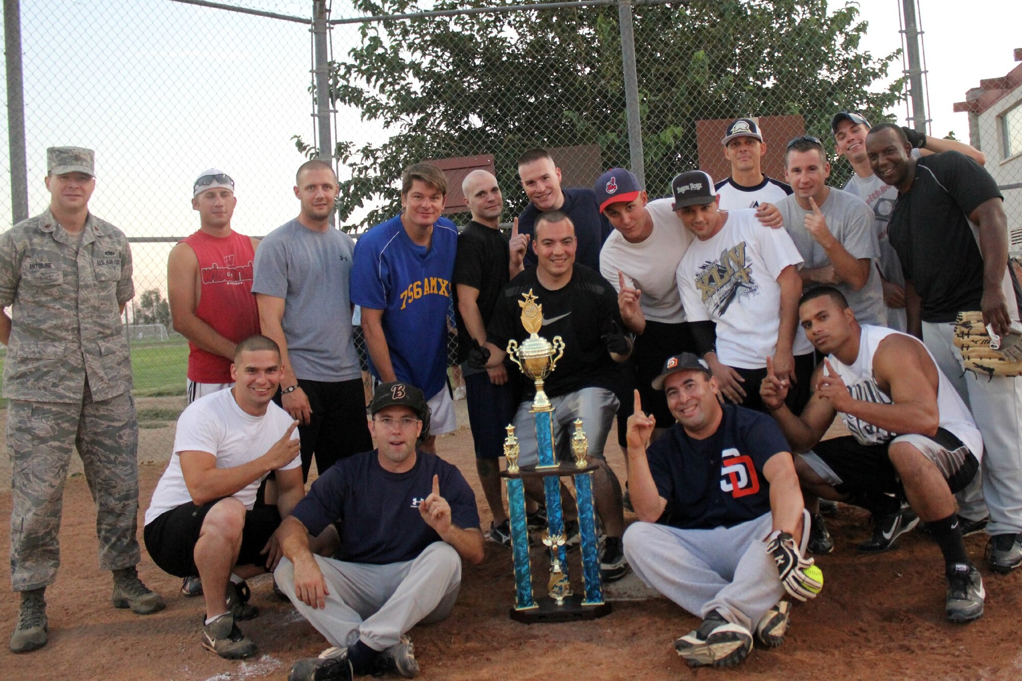 412th Aircraft Maintenance Squadron softball team members pose for a group photo after they captured the Edwards AFB softball championship with a perfect 3-0 record through the playoffs. The 412th defeated the 95th Security Forces team to win the title.