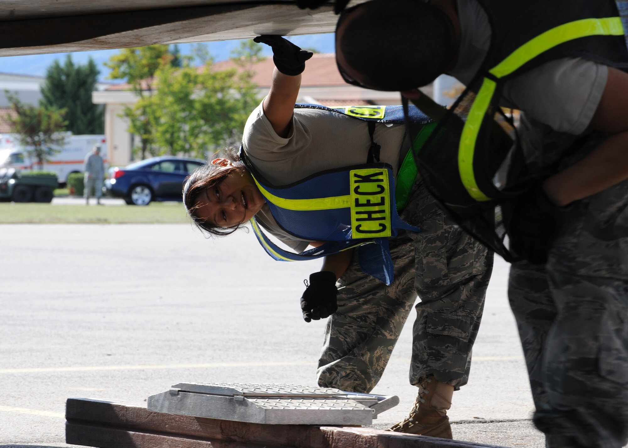 Members of the 31st Logistics Readiness Squadron inspect a cargo pallet before it is lowered to a weight scale during an operational readiness exercise Sept. 20 at Aviano Air Base, Italy. The cargo deployment function team is responsible for in processing and shipping all 31st Fighter Wing cargo requirements. (U.S. Air Force photo/ Staff Sgt. Nadine Y. Barclay)