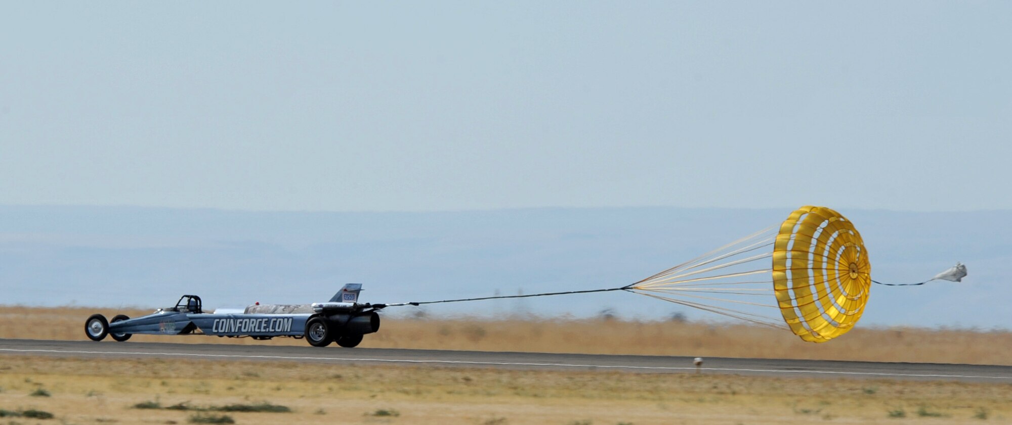 MOUNTAIN HOME AIR FORCE BASE, Idaho – Bill Braack, driver of the Smoke-N-Thunder Jet Shows car, deploys the parachute to bring the car to a stop, experiencing 11 Gs of negative force here Sept. 17. The jet car reached speeds of about 380 in nine seconds. (U.S. Air Force photo by Airman 1st Class Heather Hayward) 