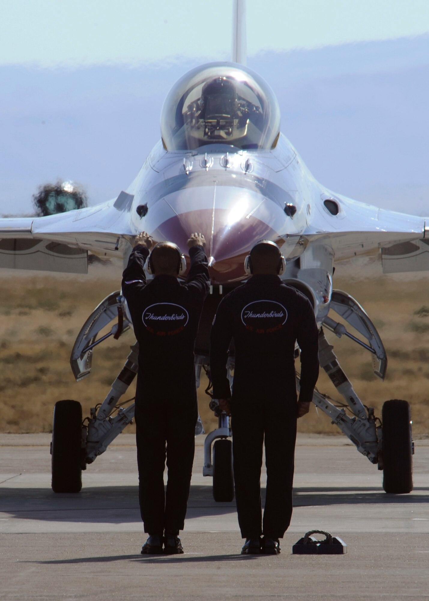 MOUNTAIN HOME AIR FORCE BASE, Idaho – The U.S. Air Force Thunderbirds mingled with the crowd to sign autographs and encourage Air Force recruits during Gunfighter Skies 2011 here Sept. 18. The Thunderbirds educated the attendees of the Open House of the mythology that inspired the Thunderbird, which is painted on the bottom of each of their aircrafts. (U.S. Air Force photo by Senior Airman Angelina Drake) 