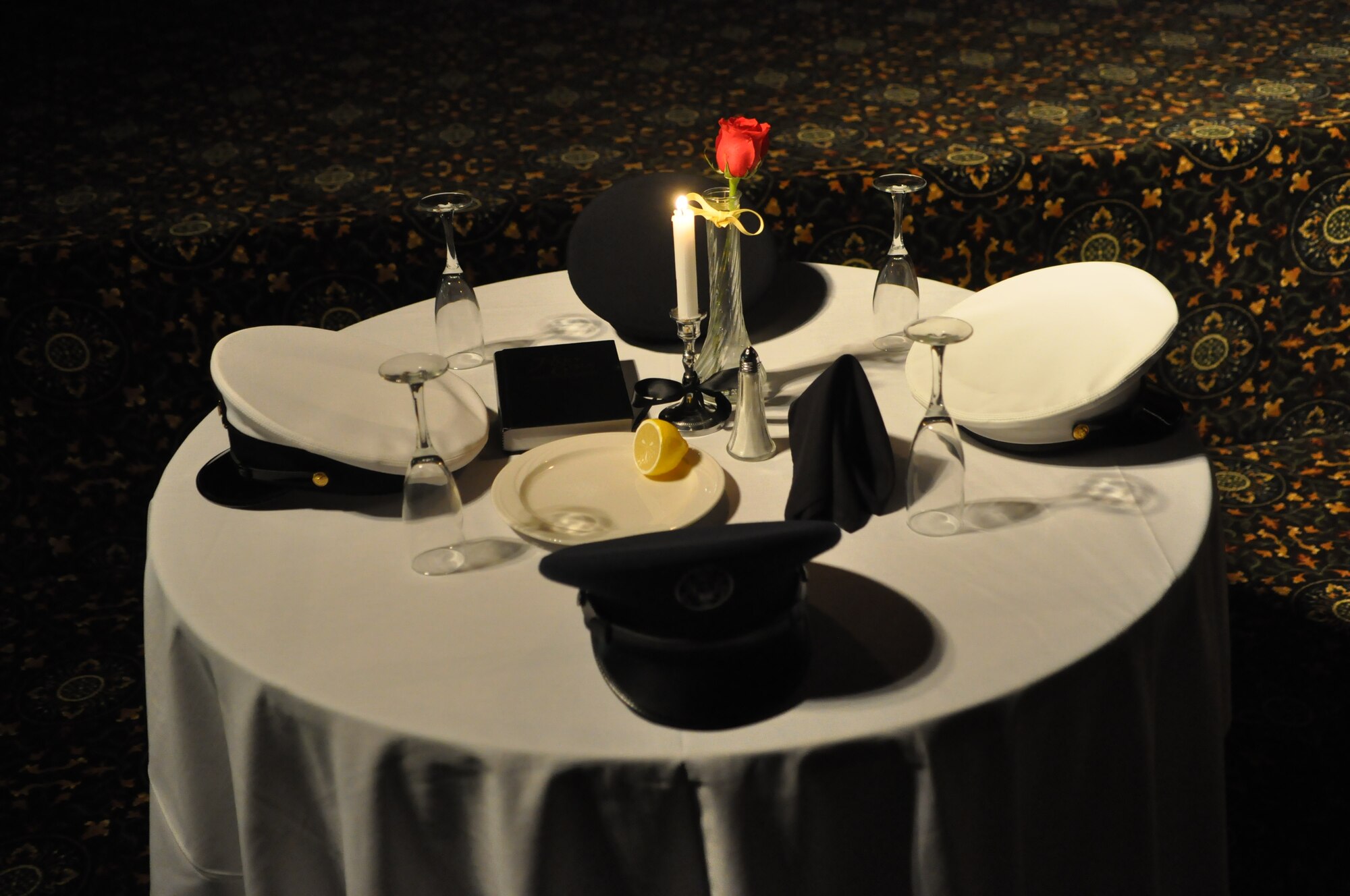 Each branch of the military is represented on the “Missing Man Table” to honor the service members missing in action during the Prisoner of War/Missing in Action Recognition Day luncheon at the McChord Field Club Sept. 16, 2011, at Joint Base Lewis-McChord, Wash. (U.S. Air Force photo/Airman 1st Class Leah Young)
